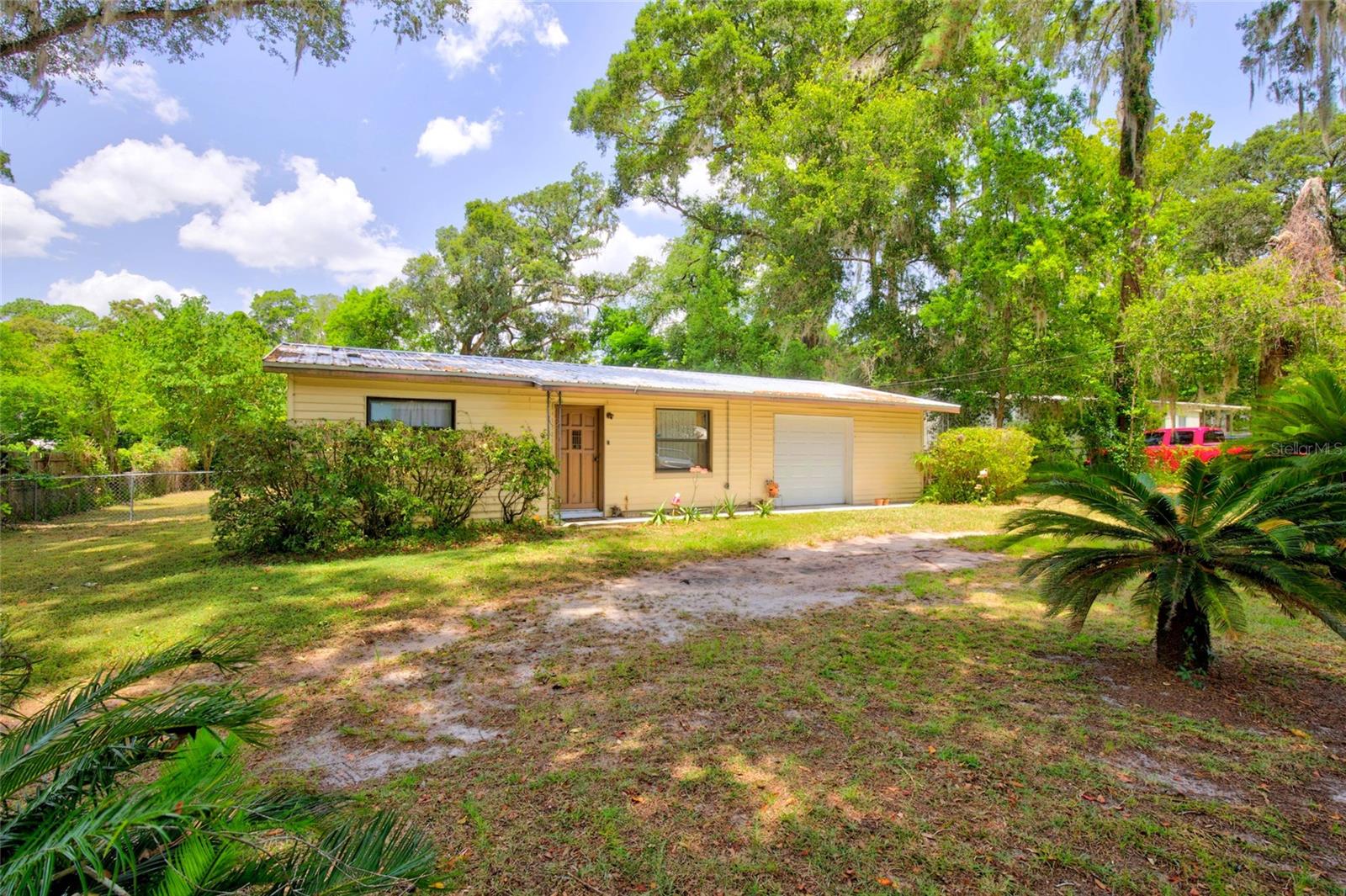 Virtually Staged. Welcome to this charming 2-bedroom, 1-bath home situated on a spacious 0.33-acre lot zoned R4 in a convenient Northeast Ocala location. This home offers comfortable living with a functional floor plan, central heating and air conditioning, gas stove, tankless hot water heater, water filter and softener system, well, and septic. Metal roof 2021, garage door replaced recently, and Hvac/AC (2006) routine service 2/2026. The oversized yard provides plenty of room for entertaining, gardening, pets, or storing your boat, RV, or other recreational vehicles (subject to local regulations). Whether you're a first-time homebuyer, looking to downsize, or searching for an investment opportunity, this property offers excellent potential. Conveniently located just minutes from shopping, dining, schools, parks, and downtown Ocala with easy access to major highways. Don't miss your opportunity to own this affordable home with a large lot and endless possibilities. Schedule your private showing today! Free appraisal with preferred lender until 7/30/26