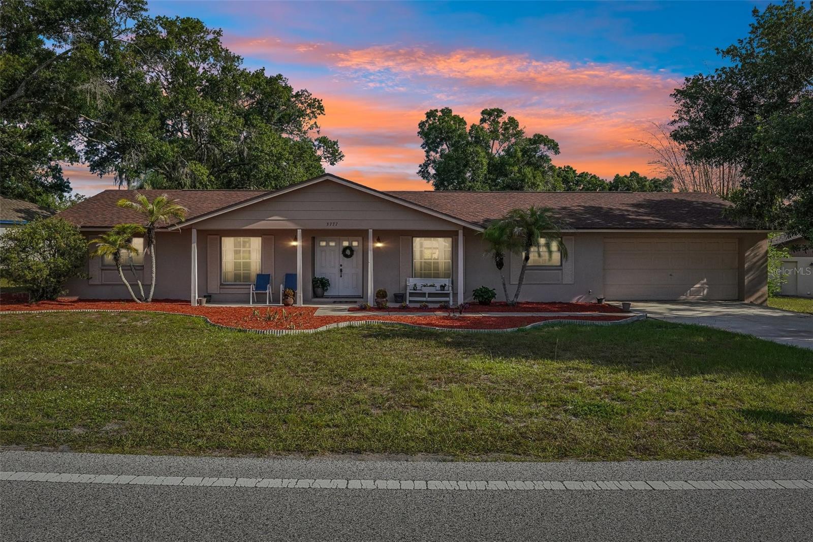 Welcome to Lake Padgett Estates East, one of Land O' Lakes' hidden gems. This established community is one of those neighborhoods people are pleasantly surprised to discover. Behind its entrance is an incredible lifestyle that many buyers don't realize exists. Communities like this are becoming harder and harder to find.

This 4-bedroom, 2-bath home sits on a generous .33-acre homesite and offers a NEW ROOF (2023), NEW HVAC (2018), and NEW WATER HEATER (2018).

Step inside to a welcoming foyer with the formal dining room to your right, perfect for holiday dinners and entertaining. Just beyond, the spacious living room is the heart of the home and features sliding glass doors leading to the backyard patio, creating an easy flow between indoor and outdoor living.

The kitchen offers abundant cabinet and countertop space, STAINLESS STEEL APPLIANCES, a breakfast bar, and a casual dining area overlooking the backyard. Just off the kitchen, the inside laundry room provides additional storage and convenient access to the backyard.

The spacious primary suite is tucked away at the rear of the home and features sliding glass doors leading to the backyard patio, dual closets, and an oversized ensuite bath with an impressive walk-in shower, creating a comfortable place to unwind at the end of the day. Three additional bedrooms provide plenty of flexibility for family, guests, or a home office.

The OVERSIZED 534-square-foot garage offers ample room for vehicles, storage, hobbies, or a workshop, while the backyard provides plenty of space to relax, entertain, garden, or even add a pool.

What truly makes this home stand out is everything that comes with it. Lake Padgett Estates East is the kind of community where neighbors know each other, friendships are built, and there's always something to enjoy. Whether you're meeting friends at the clubhouse, enjoying a meal at the restaurant, staying active with the many recreational amenities, or participating in one of the many community activities and events, it's easy to see why residents love living here.

With NO CDD FEES and a LOW HOA, residents enjoy a clubhouse with a full-service bar, restaurant, event room, pool table, fitness center, swimming pool, tennis courts, pickleball courts, racquetball courts, volleyball court, playground, running track, and a full calendar of activities and events throughout the year.

Conveniently located just minutes from SR 54, you'll enjoy quick access to shopping, restaurants, medical facilities, schools, and the Suncoast Parkway while coming home to one of Land O' Lakes' hidden gems.

If you've been searching for more than just a house, you'll appreciate the lifestyle, amenities, and sense of community that make Lake Padgett Estates East one of Land O' Lakes' hidden gems.