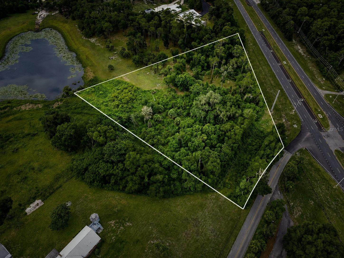 Discover the perfect opportunity to own 3.96 ACRES in VOLUSIA COUNTY, conveniently located just off US HIGHWAY 17. This build-able Corner, high and dry Hilly property offers plenty of space, Privacy, and potential. Currently zoned Residential, the property may have the possibility of being rezoned, making it a great option for those looking to explore a home-based business opportunity. Buyers should verify zoning and usage requirements with Volusia County.