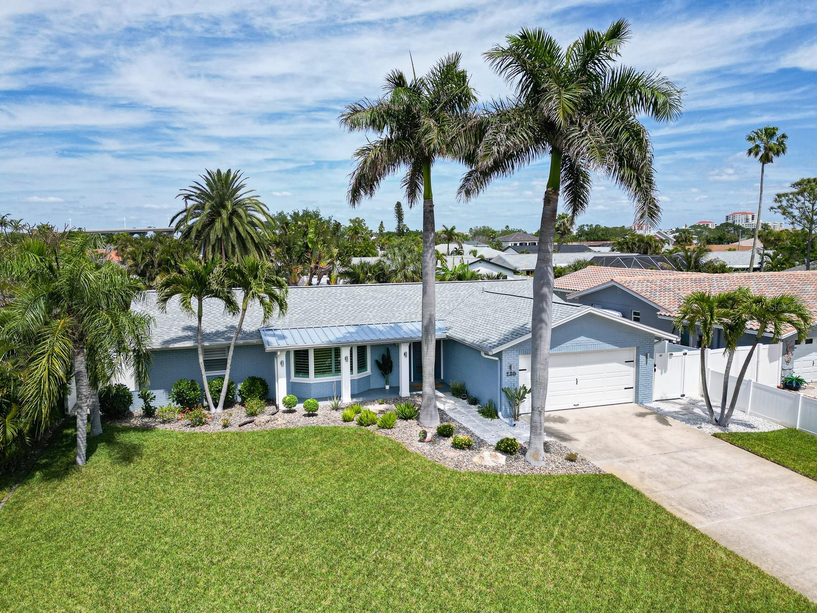 Sellers are offering concessions toward flex room customization, closing cost or rate buydown — your move-in vision, on better terms. Ask your agent how today's incentive could lower your monthly payment or bring your ideal home office, guest suite, or private retreat to life from day one. Stunning BACKYARD OASIS with a SPARKLING SALTWATER POOL — paver patio, covered outdoor living space, and tropical landscaping with soaring palms and flowering plants, all enclosed within a 6-foot privacy fence. WELCOME TO VINA DEL MAR — one of the most prestigious and desirable neighborhoods in ST PETE BEACH, where a palm-lined corridor along Pass-A-Grille Way sets the tone for a community defined by manicured surroundings and a distinct coastal character that stands apart from every neighboring area. Tucked just behind PASS-A-GRILLE, consistently ranked among the best beaches in the United States, this island enclave delivers a rare combination of location, elevation, and lifestyle that cannot be replicated on the barrier islands. Rare opportunity to own a truly turnkey block construction pool home in one of the neighborhood's most sought-after pockets. This 2-bedroom, 2-bath residence with a true bonus room delivers square footage that rivals — and often exceeds — neighboring 3- and 4-bedroom listings, with a bedroom-sized flex space off the primary suite ideal as a home office, guest suite, or private retreat. A bright sunroom adds flexible living space bathed in natural light. The open/split floor plan is anchored by driftwood-style porcelain tile flooring, custom interior doors blending clean lines with subtle dimension for a modern-coastal aesthetic, frosted glass panel pocket doors, and plantation shutters. The fully remodeled kitchen is the heart of the home: quartz countertops, all-wood cabinetry with soft-close drawers, a pantry with pull-out shelving, KitchenAid appliances, wine storage, and a showstopping 100-year-old cypress beam — a one-of-a-kind detail you won't find anywhere else. Every room — kitchen, living room, and primary suite — looks out onto the lush, private backyard. Open the doors and the outside simply becomes part of the home. Curb appeal is polished: paver entry, PVC column wraps with exterior sconces, and manicured landscaping accented with river stone and boulders along the walkway. The two-car garage features a hurricane-rated door. This golf cart-friendly neighborhood sits moments from pickleball courts, tennis, a dog park, playground, and shaded walking paths. Gulf beaches are minutes away. Downtown St. Pete and Tampa Airport are an easy drive. Primary residence, second home, or investment property — this home checks every box. Situated in the section of Vina del Mar served by underground utilities, solid block construction and quality infrastructure represent exactly the kind of foundation today's Florida buyer wants. Major system upgrades: New roof (2025) · Whole-house water softener & filtration (2022) · Pool pump (2024) · Salt Cell (2026) Water heater (2020) · Pebble-finish saltwater pool (2017). Additional upgrades include: HVAC with ductwork & Air Knight air purification, Electrical panel, Gutters, and more. Complete upgrade history available upon request. Extensively updated. Solid block construction. Underground utilities. In one of St. Pete Beach's most coveted communities. Opportunities like this are rare. Offers received by June 30 are eligible for seller concessions. Schedule your private showing today!