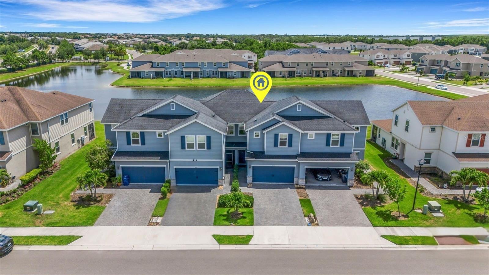 BETTER-THAN-NEW WITH A WATER VIEW! Tucked away on a quiet, low-traffic street in Woodleaf Hammock — a BOUTIQUE ACTIVE-LIFESTYLE, GATED COMMUNITY in the heart of Lakewood Ranch, this IMMACULATELY MAINTAINED, MOVE-IN READY 3-bedroom, 2.5-bathroom townhome boasts NEARLY 2,000 SQFT, an OVERSIZED TWO-CAR GARAGE & a COVETED MID-POND VIEW. Everything about this townhome epitomizes EASY & ENERGY-EFFICIENT FLORIDA LIVING — ULTIMATE LIVABILITY. After entering through the seamless modern gate system and ambling through the friendly, well-kept community, you’ll love pulling into your pavered driveway & TWO-CAR GARAGE — a rare luxury in townhome living. As you stroll up to the front door, you’ll be struck by the subtle grandeur of the covered entryway and 10-foot door. Upon entering the residence, you’ll feel right at home in the thoughtfully-designed Burbank floor plan that features the perfect blend of flexibility, form, and function. To the right of the front entry is a versatile flex room with countless potential uses — formal dining room, home office, play room, formal living room, craft room, man-cave — just to name a few. Past the flex room, as the hallway opens to the main living/dining room & kitchen you’ll be awed by the cascade of natural light gleaming through the ENERGY STAR-qualified windows overlooking the UNOBSTRUCTED POND VIEWS. Whether you’re enjoying a cup of coffee on the covered lanai, a meal at the dining room table, a book on the couch or cooking  a meal in a kitchen, the SERENE WATER VIEWS from the every angle bring a unique sense of calm & tranquility. The open kitchen features GRANITE COUNTERTOPS, timeless white shaker cabinets, ENERGY-EFFICIENT STAINLESS STEEL APPLIANCES, CABINET PANTRY, & A REVERSE OSMOSIS WATER FILTRATION SYSTEM. With all three bedrooms & the laundry room on the second story, this townhome offers the perfect separation between public and private spaces. The SPACIOUS PRIMARY BEDROOM features tray ceilings, a giant walk-in closet, ensuite bathroom with dual vanities, walk-in shower, private water closet, and expansive water views. The additional two bedrooms feature sizable walk-in closets and share a Jack & Jill bathroom. An additional highlight of this townhome is its exceptional private outdoor space — a covered lanai overlooking the yard and pond. On top of all the show-stopping features of the townhome itself, Woodleaf Hammock residents enjoy EXCLUSIVE ACCESS to RESORT-STYLE AMENITIES including a pool, outdoor kitchen/grill area, pickleball courts, dog park, playground, and walking trail all within this METICULOUSLY-MAINTAINED, BOUTIQUE GATED COMMUNITY. Conveniently-located just minutes from countless shopping & dining options, University Town Center, Lakewood Ranch Main Street, top-rated schools & medical facilities, world-class beaches, and offering easy access to I-75 and several local airports. Don’t waste another minute — seize the rare opportunity to make EFFORTLESS, ENERGY-EFFICIENT, MAINTENANCE-FREE, RESORT-STYLE FLORIDA LIVING yours today! Schedule your private tour now!
