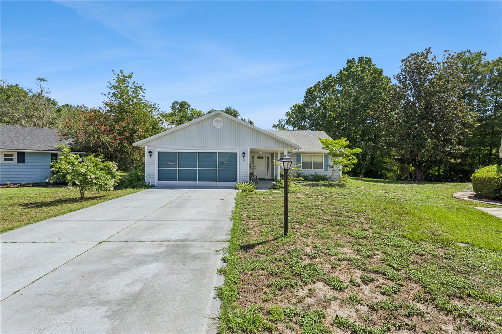 A rare combination of privacy, nature, and space! Nestled at the end of a quiet cul-de-sac on an oversized 0.37-acre lot, this well-maintained 2-bedroom, 2-bath home offers 1,528 square feet of living space plus an expansive 12' x 28' screened lanai. Backing directly to a protected conservation area with no rear neighbors, this home offers one of the most private and peaceful settings in Scottish Highlands. Inside, you'll find an open floor plan with soaring ceilings and an abundance of natural light. The spacious kitchen offers plenty of cabinet and counter space. The oversized screened lanai is the true showstopper, perfect for enjoying your morning coffee, entertaining guests, or simply taking in the peaceful conservation views and Florida wildlife year-round.
Additional features include a two-car garage with a retractable screen door, mature trees that enhance the home's natural beauty, and an oversized backyard rarely found in the community. Located in the desirable 55+ community of Scottish Highlands, residents enjoy an active yet peaceful lifestyle with an indoor Olympic-size pool, pickleball, tennis, shuffleboard, clubhouse, and more. If you've been waiting for a home with an unbeatable lot, unmatched privacy, and serene conservation views, this is the one you've been looking for. A/C WAS REPLACED MARCH 2025.