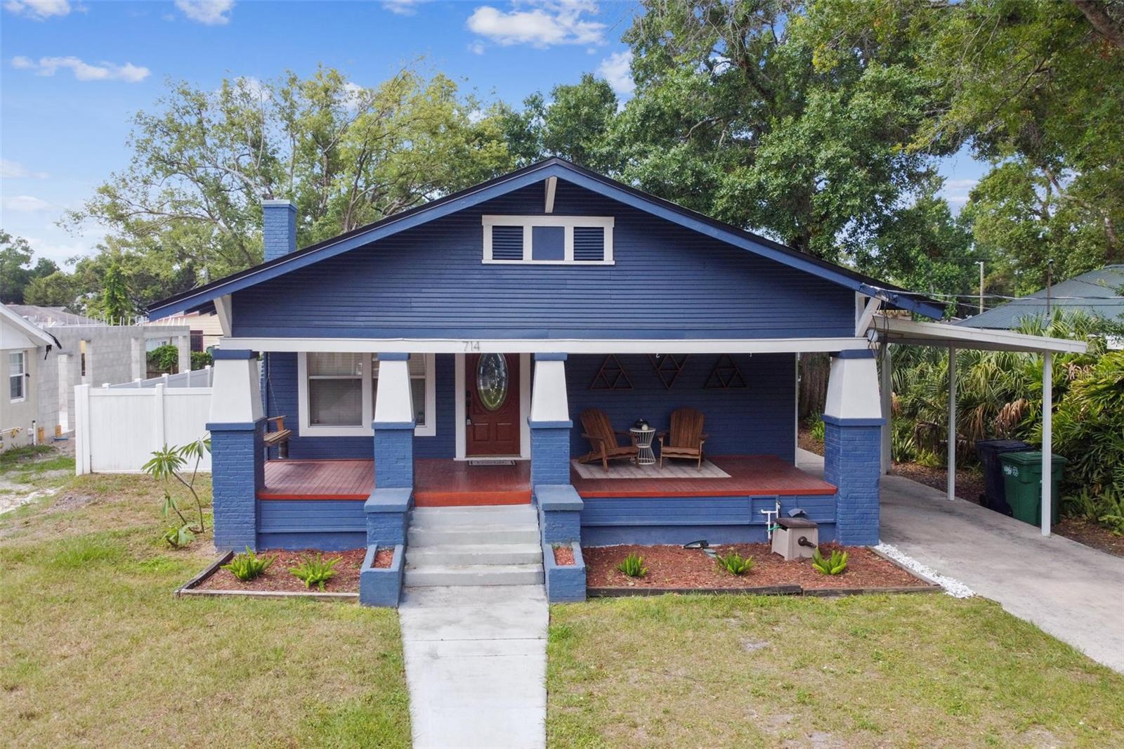 This 2-bedroom 2-bathroom historic bungalow is in the heart of Riverside Heights and is available for immediate occupancy! Pull in the private driveway that leads up to the attached carport and open front porch with a swing where you can sit and relax after a long day. As you enter this lovely home from the quaint, open front porch you will immediately notice the original wood floors and crown molding in the combination living and dining room. There is an abundance of natural light that makes this space feel warm and inviting. Continue into the totally remodeled kitchen where you will fall in love with Samsung stainless steel appliances, gas stove, dual oven, 42" wood cabinets, subway tiled backsplash, and farmhouse sink. This beautiful space leads into the laundry room and then out to the large, fenced yard where you will have plenty of space to relax, play, and entertain. The LG washer/dryer, patio furniture with sun shade and 10’ x 14’ storage shed are ALL included! The large master bedroom suite also features a spacious sitting area before entering the private bath with his-and-her sinks. This home comes with a brand new A/C unit and Nest thermostat, ceiling fans throughout, and a tankless water heater all to help keep your energy costs down! Riverside Heights is only minutes away from Seminole Heights, Armature Works, Downtown Tampa, and many other hot spots in one of the fastest growing cities in the U.S.!