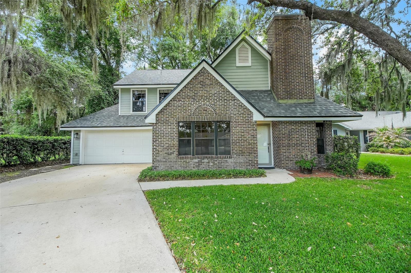 One or more photo(s) has been virtually staged. Country Creek — where lifestyle meets location! Tree-lined streets wind through this popular Altamonte Springs community, creating the perfect setting for daily walks, bike rides, and happy pups. Tucked away on a cul-de-sac, this charming 4-bedroom, 2-bath home offers delightful curb appeal with brick accents, shady oak trees, and a welcoming feel. Inside, you’ll find wood floors in the living and dining rooms, laminate flooring in all bedrooms — no carpet! The kitchen features stainless steel appliances, granite countertops, and plenty of storage. The highlight is the spacious screened porch and brick patio overlooking a fabulous backyard with room for pets, play, gardening, or simply relaxing outdoors. Major bonus: roof replaced in 2025! Country Creek offers a low HOA and wonderful amenities including a community pool, clubhouse, tennis/racquetball courts, basketball courts, and playgrounds. Altamonte Springs offers nearby Lake Lotus Park and an abundance of shopping & dining options.  And, Country Creek is minutes from Downtown Orlando, Maitland Center, and the Lake Mary business corridor — this home blends work, life, and recreation in a beautiful natural setting. Fantastic Seminole County Schools!