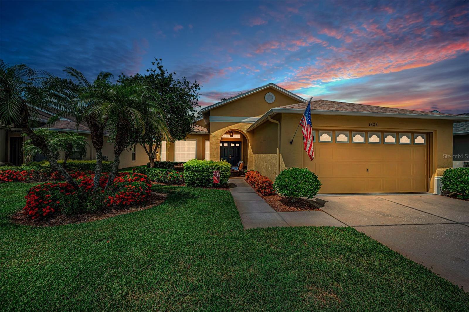 Welcome to this beautifully maintained 3-bedroom, 2-bath, 2-car garage home offering over 1,700 square feet of bright, comfortable living space. The home features a NEW ROOF (2021), NEW HVAC (2022), NEW WATER HEATER (2024), NEW WASHER & DRYER (2025) and Updated Kitchen (2019). Designed with an open-concept floor plan, the home features soaring vaulted ceilings, oversized windows that fill the interior with natural light, and a neutral color palette that creates a warm and inviting atmosphere.  Thoughtful upgrades include plantation shutters, easy-care tile flooring throughout, recessed lighting, and a spacious interior laundry room complete with built-in cabinetry for added storage and convenience.  The expansive great room opens through large sliding glass doors to a private enclosed lanai surrounded by lush landscaping, creating the perfect space to enjoy your morning coffee, unwind in the evening, or entertain family and friends while enjoying peaceful backyard views.  One of the three bedrooms is currently used as a versatile den/home office, offering flexibility to suit your lifestyle. The spacious primary suite provides plenty of room for a sitting area or reading nook and features an en-suite bath with dual vanities, a step-in shower with beautiful tile and generous storage. The guest bedroom is comfortably sized and conveniently located near the second full bath.  Enjoy the best of Florida living in this vibrant, amenity-rich community featuring a clubhouse, heated pool and spa, championship golf course, restaurant, fitness center, tennis courts, library, and a full calendar of clubs, social events, and activities.  Conveniently located just minutes from beautiful Gulf beaches, shopping, dining, medical facilities, and Tampa International Airport, this exceptional home offers the perfect blend of comfort, convenience, and resort-style living.