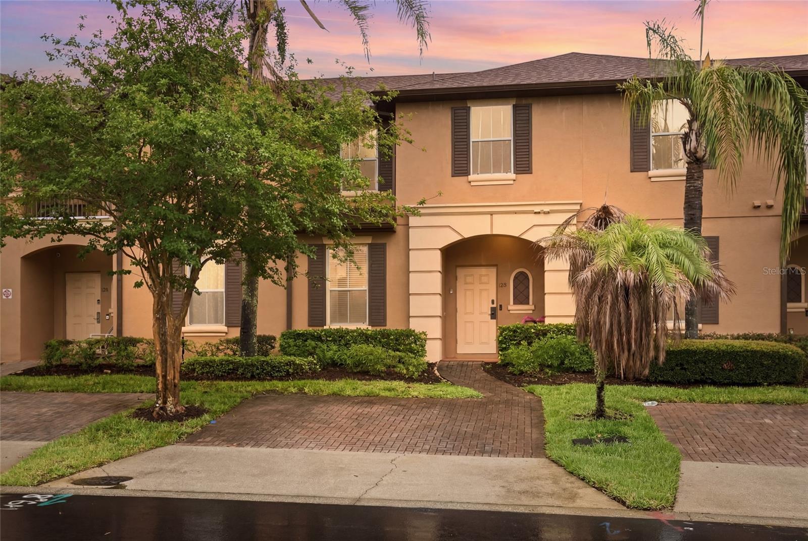 Not all homes in Regal Palms are created equal, and this exceptional residence is proof. Beautifully renovated, impeccably maintained, and being sold fully furnished, this turnkey property is ready to begin generating rental income immediately or become your own full-time Florida retreat.
From the moment you arrive, you'll appreciate the charming front porch, brick paver driveway, assigned parking, and inviting curb appeal. Inside, nearly every detail has been thoughtfully upgraded. The showstopping kitchen has been completely reimagined with floor-to-ceiling custom cabinetry, a timeless farmhouse sink, premium stainless steel appliances, an upgraded washer and dryer, and an abundance of storage rarely found in the community. Updated flooring, recessed lighting, designer ceiling fans, and modern finishes throughout create a bright, sophisticated space that feels better than new.

Upstairs, all bedrooms are privately situated, creating the perfect separation between entertaining and relaxing. Every room reflects the pride of ownership and meticulous care that make this home truly move-in ready.
Step outside to one of this home's most extraordinary features—an oversized screened lanai with a private hot tub overlooking no rear neighbors. This expanded outdoor living space is one of the few grandfathered extensions in Regal Palms and can no longer be added, making it an incredibly rare amenity that sets this property apart from virtually every other home in the community. Whether you're enjoying your morning coffee or unwinding after a day at the parks, this private outdoor retreat is a feature guests and owners alike will appreciate.
Beyond your front door, Regal Palms offers one of Central Florida's most sought-after resort lifestyles. Behind the 24-hour guard-gated entrance, you'll discover a tropical paradise featuring sparkling resort pools, a lazy river, exhilarating waterslides, a full-service spa, fitness center, arcade, playground, volleyball court, restaurant, bar, ice cream shop, and beautifully landscaped grounds lined with towering palm trees that truly live up to the community's name.
Perfectly positioned just off Highway 27, you'll enjoy quick access to Publix, Target, Starbucks, Posner Park, championship golf courses, endless dining and shopping, and Walt Disney World just a short drive away.
Whether you're searching for a high-performing short-term rental, a vacation getaway, or a full-time residence, opportunities like this are incredibly rare. While there are many homes in Regal Palms, few offer this level of renovation, this exceptional condition, and a grandfathered outdoor living space that simply cannot be replicated. This is more than a home—it's a lifestyle and an investment you'll be proud to own.