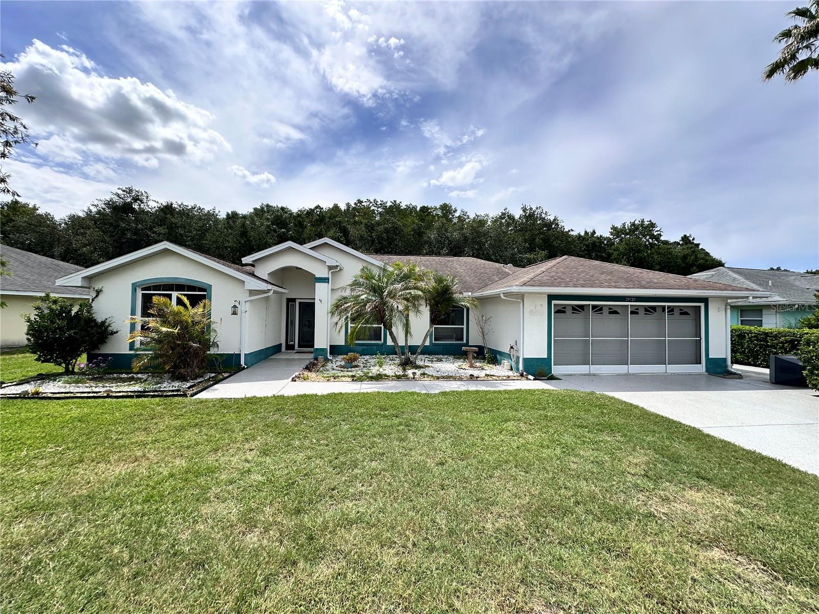 Welcome to resort-style living in the highly desirable 55+ community of Tampa Bay Golf & Country Club! This beautifully maintained 3-bedroom, 2-bath pool home with an office, offers a 2-car garage plus a separate golf cart garage, providing plenty of space for vehicles, storage, and all your Florida lifestyle essentials. Step inside to discover a spacious and inviting floor plan designed for comfortable everyday living and entertaining. The highlight of this home is the private backyard oasis featuring an in-ground swimming pool with a screened enclosure, perfect for enjoying Florida’s sunshine year-round. Beyond the pool, you’ll appreciate the peaceful conservation views, where deer and other wildlife are frequently seen, creating a tranquil natural setting with no rear neighbors. Whether you’re enjoying your morning coffee overlooking the conservation area or relaxing poolside after a day of activities, this home offers the perfect blend of privacy and leisure. Residents of Tampa Bay Golf & Country Club enjoy an active lifestyle with outstanding amenities including golf, clubhouse, fitness center, swimming pools, tennis, pickleball, social clubs, and numerous activities designed for active adults. Don’t miss this opportunity to own your own piece of paradise in one of the area’s most sought-after active adult communities!