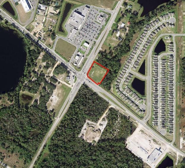 Commercial property located at the signalized intersection of US Highway 17-92 and Ronald Reagan Parkway in northeast Polk County. According to the Ronald Reagan Parkway Selected Area Plan the Future Land Use for this vacant property is Community Activity Center (CACX) which permits such uses as retail and service, restaurant, indoor entertainment, bars/taverns, cinemas, attached residential, office, hotel/motel, gasoline sales, and social establishments. This site was formerly the location of a small, family-owned gas station/convenience store and is directly across the street from Loughman Crossings, a Publix-anchored shopping center.