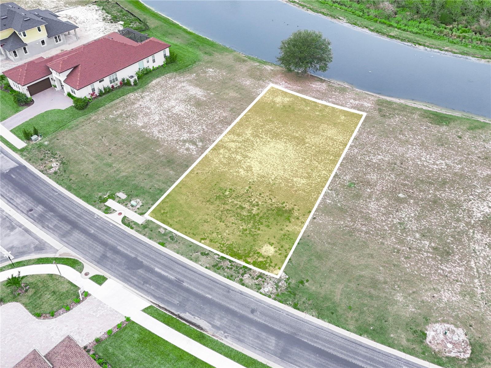 OWNER FINANCING AVAILABLE! Discover the perfect opportunity to build your dream home in the prestigious gated community of Water Ridge in Auburndale, Florida. This .21-acre vacant lot offers serene drainage canal views, ensuring backyard privacy and tranquility. The adjoining 25' drainage easement provides an additional buffer on the south side of the neighboring property, enhancing lot. Water Ridge is designed to embrace Florida's sunny weather, featuring three beautiful pools, four lighted tennis courts, scenic walking trails, an expansive recreational field, and convenient access to boating ramps. Water Ridge offers boat storage and a community dock to drop boat in Lake. Enjoy a variety of water activities year-round, making it an ideal location for families and outdoor enthusiasts. Don't miss out on this incredible opportunity to create your custom home in the sought-after Water Ridge community. Act now and start living the Florida lifestyle you've always dreamed of!