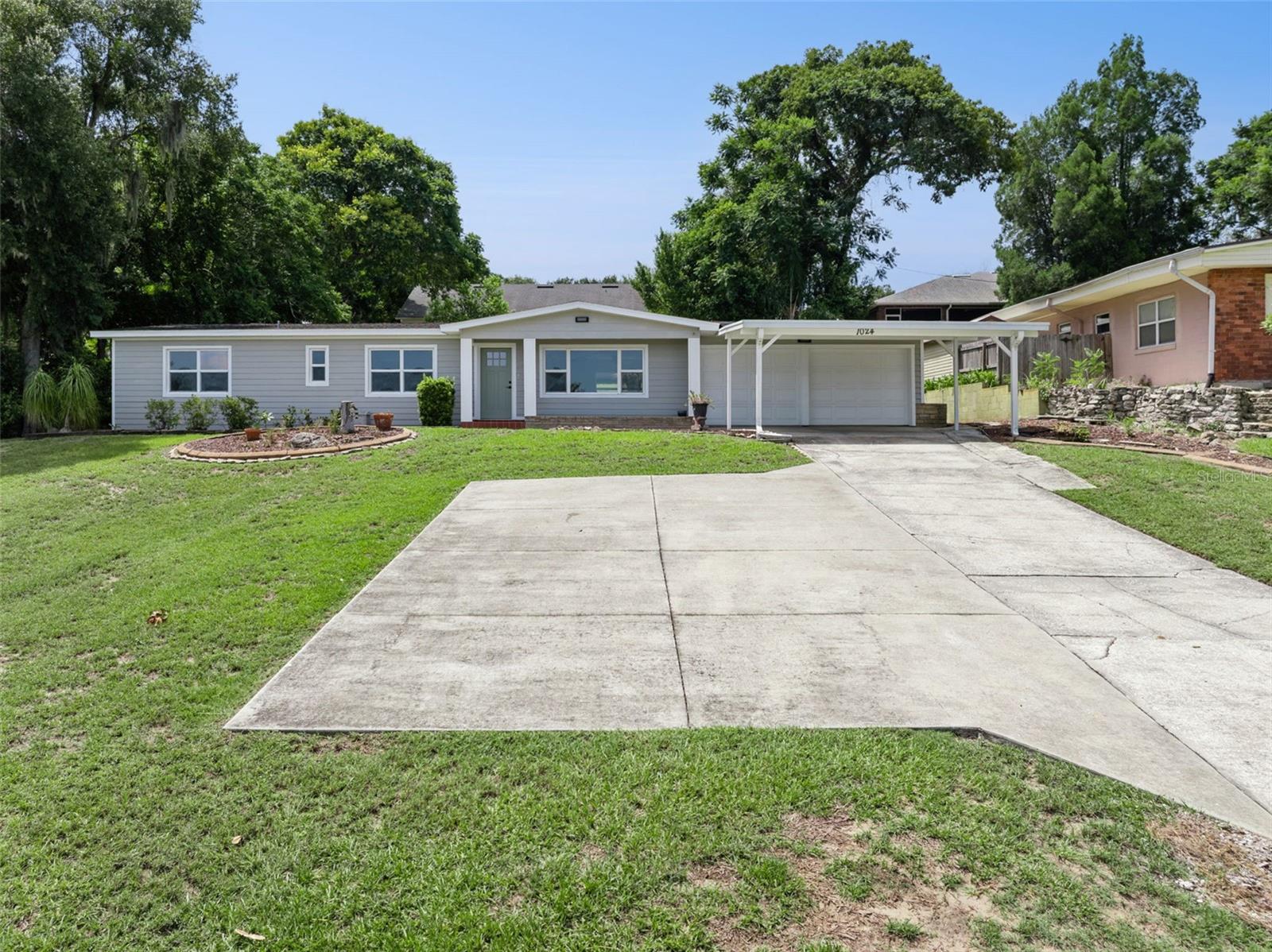 FULLY REMODELED HOME WITH BEAUTIFUL LAKE WAILES LAKE VIEWS! This beautifully updated 3-bedroom, 2-bath home is move-in ready and offers modern comfort, functional living spaces, and scenic views of Lake Wailes Lake from the living room. The spacious family room and living room combination creates an inviting atmosphere for both everyday living and entertaining, while the remodeled interior features energy-efficient Thermapane windows that fill the home with natural light. The primary suite includes a beautifully updated bathroom with a walk-in shower, and the guest bedrooms are connected by a convenient Jack-and-Jill bathroom. Outside, you'll enjoy a fully fenced backyard with a storage shed complete with electricity, perfect for a workshop, hobby space, or extra storage. A 2-car garage and additional 2-car carport provide plenty of parking and storage for vehicles and recreational equipment. Conveniently located near shopping, dining, schools, and local amenities, this exceptional home offers the perfect combination of stylish updates, practical features, and beautiful lake views. Schedule your private showing today!