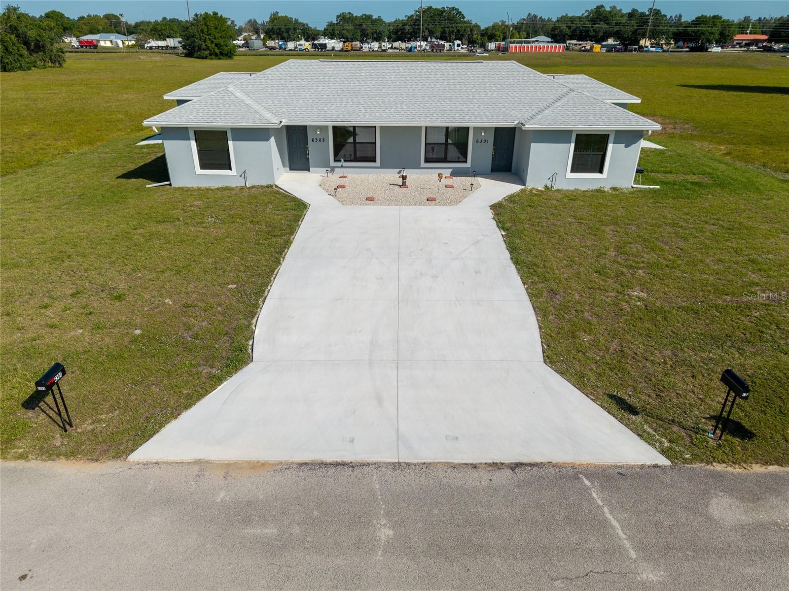 If you’ve been looking for a solid, income-producing property in the growing Spring Lake area, this newer duplex is definitely worth a closer look. It’s already fully rented with leases in place through the end of the year, so you can step right into steady cash flow from day one. Both units were built with durability and style in mind, featuring wood-look plank tile flooring throughout—something tenants love for its modern feel and easy maintenance. The kitchens are bright and inviting with white cabinetry, granite countertops, plenty of workspace, and a convenient bar-top that adds extra functionality. There’s also an oversized pantry and a generously sized laundry room just off the kitchen, which renters always appreciate for the added storage and convenience. The bathrooms continue that clean, upscale look with floor-to-ceiling tiled walk-in showers—no tubs here—giving the space a sleek, updated feel that tends to attract and retain quality tenants. Each unit also includes its own private 1-car garage, a major plus for renters looking for extra storage, security, and convenience—especially in this market. Everything is consistent across both units, from finishes to design, making management simpler and keeping the property looking cohesive and well cared for. Location is another big draw. Being close to Sebring International Raceway brings in steady interest from renters year-round, whether they’re motorsports enthusiasts, seasonal visitors, or people connected to events at the track. That kind of local demand can help support strong occupancy and rental stability. This is a great opportunity to add a newer, low-maintenance duplex in a desirable Sebring community to your portfolio. Showings are available by appointment with advance notice, so you can plan accordingly without disrupting current tenants.