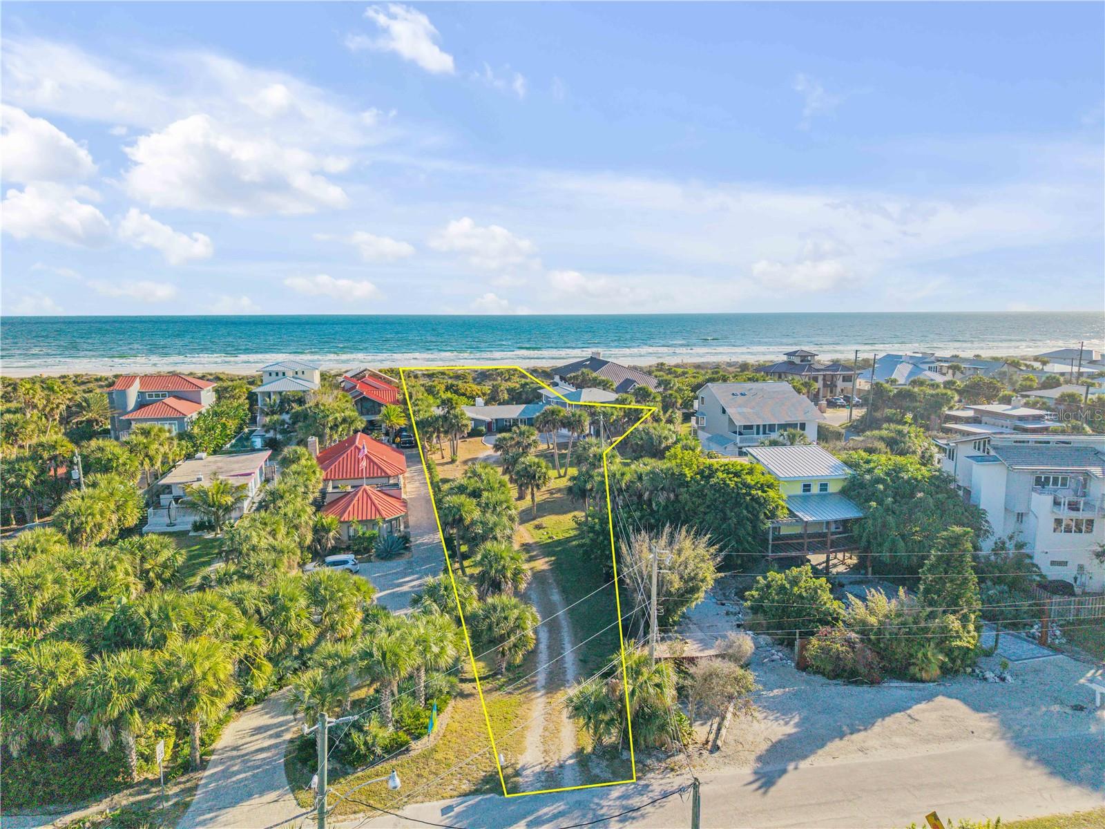 Discover a rare opportunity to own a true oceanfront estate in the highly sought-after North Beach area of New Smyrna Beach. Situated on an oversized 0.82-acre lot spanning approximately 35,925 square feet, this exceptional property offers privacy, space, and endless potential along one of the area’s most desirable stretches of coastline. The residence features 5 bedrooms, 5.5 bathrooms, and nearly 5,000 square feet of living space under air, creating the ideal setting for a luxury coastal retreat, multigenerational getaway, or legacy family estate. Originally built in 1960, the home has been thoughtfully updated with new windows, a full-house HVAC system, and a 2018 roof, blending timeless character with important modern improvements. The true value of this rare offering lies in the premier direct oceanfront location and the extraordinary size of the lot — a combination seldom available in today’s market. The expansive property presents a unique opportunity to design and build a custom three-story beachfront estate complete with separate guest or in-law living quarters, a private courtyard-style pool, and expansive indoor-outdoor living spaces tailored for entertaining and long-term family enjoyment. Whether preserved, renovated, or reimagined into a one-of-a-kind coastal compound, this property offers the chance to create a true generational beachfront estate in one of the most exclusive oceanfront settings in New Smyrna Beach.