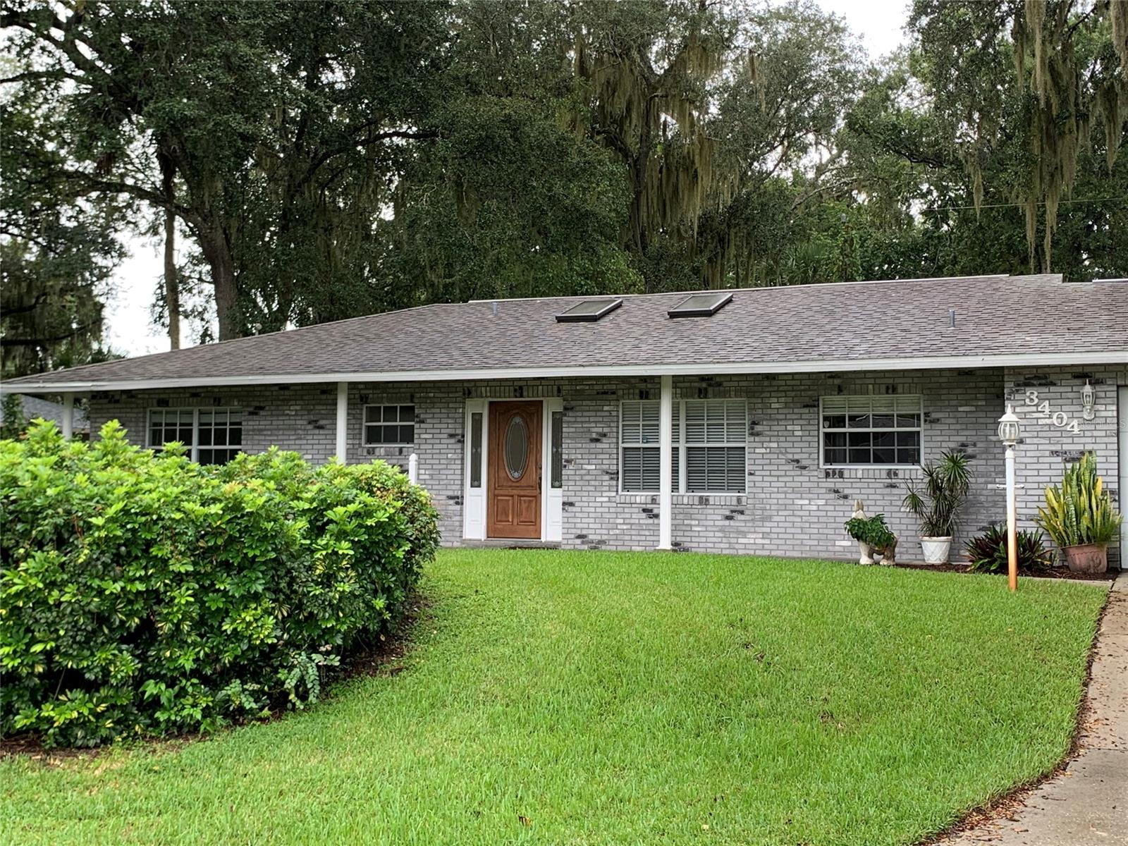 Beautiful home on 3 lots and Easment corner.. Beautiful kitchen with Corian countertops,custom made drawers & maple cabinets ,large dining room,and  2 car oversized garage,lush landscaping, florida room under air + screened in porch(all tile) that overlooks the back yard. Pergo & tile flooring. Only the master bedroom has carpet. Completely fenced in. Master bath with his/her vanities/large walk-in shower (handicap) Master bedroom with french door leading to the lanai for your evening relaxation or Hot Tub and a large walk -in closet. 3rd bedroom can be used as an office or flex room, it has Pocket Doors opening into living room and french doors leading to the enclosed family room. Irrigation system in front/back yard and well with pump for watering. This house is great for family and friends entertainment. all measurements are approx. Come and see this house before it is gone!! Room for RV'S and Boats with gravel on south side of front yard!!! OWNER MOTIVATED!! ;Water: City