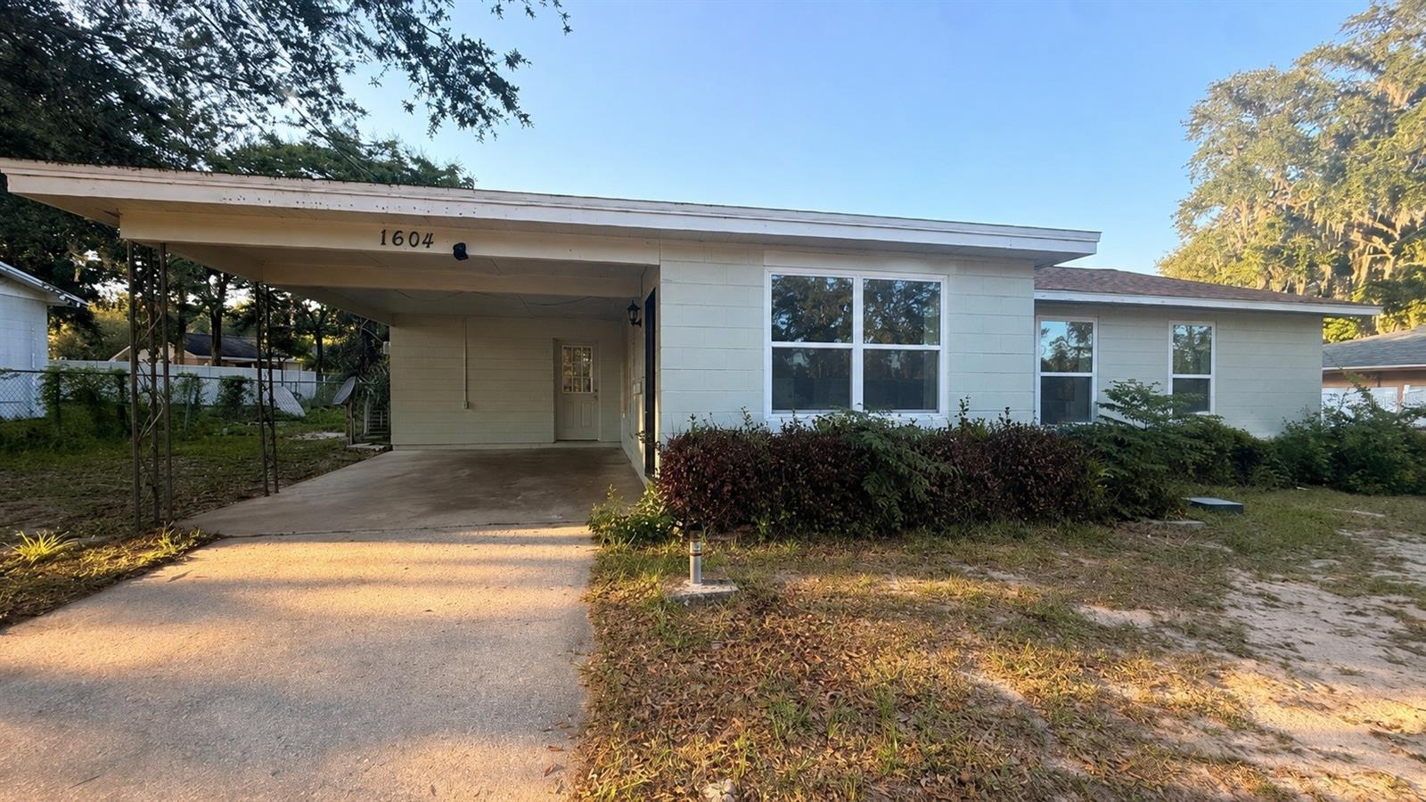 Welcome to 1604 Woodlyn Dr, a spacious 3-bedroom, 2-bathroom home conveniently located in Leesburg, FL! This home features a covered carport, large driveway, and a bright open layout with plenty of natural light throughout. Enjoy a spacious living area, generously sized bedrooms, and a large backyard perfect for relaxing or entertaining.

Conveniently located near shopping, dining, schools, and major roadways with easy access to everything Leesburg has to offer.

Don’t miss your opportunity to call this home yours, schedule your showing today!
Pets Not Allowed!
Tenant Liability Insurance **Required**