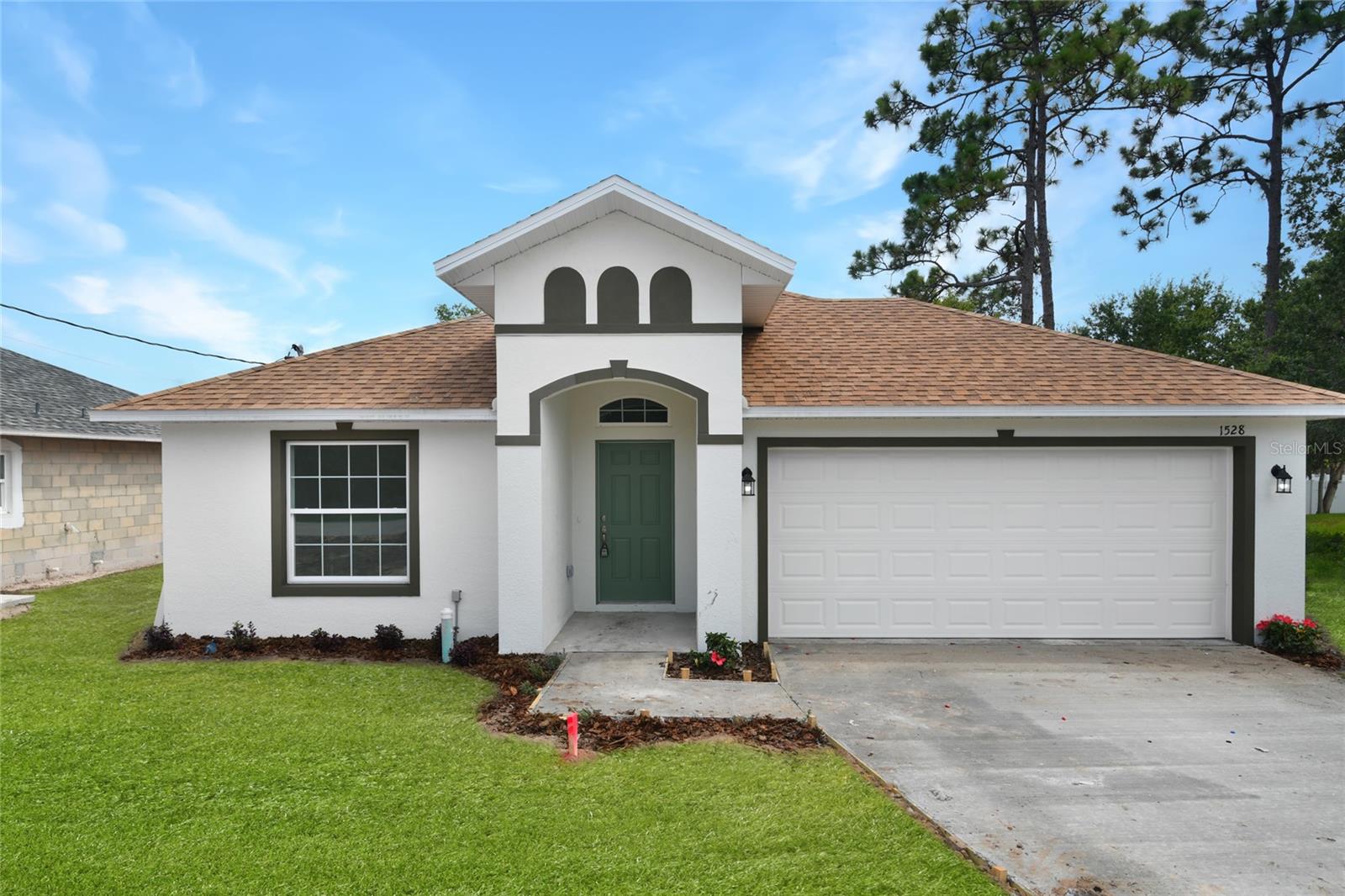 This stunning new construction home boasts 4 spacious bedrooms, 2 modern baths, and an open floor plan perfect for entertaining. You'll love the stylish granite countertops and the chic tile flooring throughout the house. With soaring vaulted ceilings, this home feels spacious and bright, offering plenty of natural light and a comfortable atmosphere. You'll feel right at home in this cozy haven, perfect for family gatherings or intimate get-togethers with friends. Located near Orlando International Airport, this home is ideally situated for those who love to travel or need easy access to the airport. The surrounding area offers plenty of shopping, dining, and entertainment options, so you'll never run out of things to do. Don't miss out on this amazing opportunity to own your dream home in a prime location. Schedule a showing today and start living your best life in this stunning new construction home!