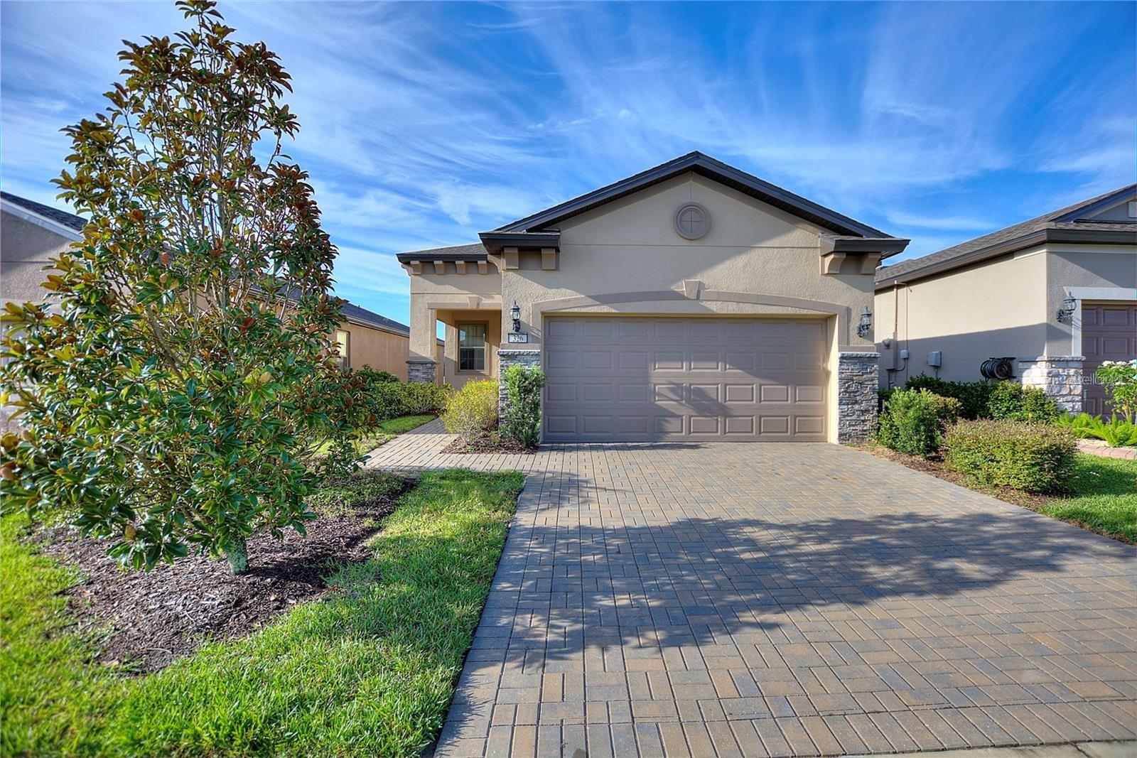 New Price..Welcome to 326 Almansa Street, located in the sought-after Del Webb - Orlando’s active 55+ community. This beautiful home is just like new and has been upgraded with custom details throughout. You will notice the bright, cheerful ambiance created by lots of natural light and an open concept design. You will love the stylish gray tile floors that flow throughout the living space and the upgraded ceiling fans and light fixtures. The kitchen comes with trendy stainless-steel appliances and granite counter tops, with a center island large enough for four bar stools and upgraded 42" kitchen cabinets with crown moulding and a tiled back splash. Into the master bedroom, you’ll find attached en-suite bath with double sinks, granite counter tops and a glass shower door, as well as a large walk-in closet. The second bedroom also has carpet and an ample closet. An added bonus is the beautiful lanai out back – a perfect spot for coffee in the morning or entertaining family and friends. The possibilities for fun and entertainment are endless here with tennis, bocce, pickle ball, two pools, hot tub, fitness room/ track and a pub - all conveniently located near Disney World, Universal, Sea World, water parks, popular restaurants, outlet malls, major highways, and the beach. Don’t miss an opportunity to make this breathtaking home yours - make an appointment to view this amazing property today!