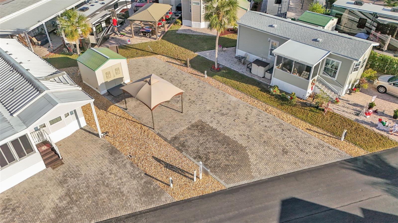 PRICE IMPROVEMENT! Low-maintenance living in the Florida Sunshine on your own upgraded RV pad in Elite Resorts at Citrus Valley! This popular community is located in Clermont, close to Disney (12 miles) and many Central Florida Attractions. Park and enjoy on an oversized paver pad, with parking area, gazebo and 10x10 storage shed. You'll have plenty of room for any size RV with 50 amp electrical service, water supply and sewer services on charming Citrus Tree Road. The community amenities are a big value with high speed internet, cable, sewer, trash, water, grounds maintenance, community pool, bathhouses, playground, gate, grass cutting and more included in your condo dues ($786 each quarter). Plus enjoy social events, beautiful weather, Bingo and many nearby attractions as part of the Florida lifestyle. Call today to set up your showing!
