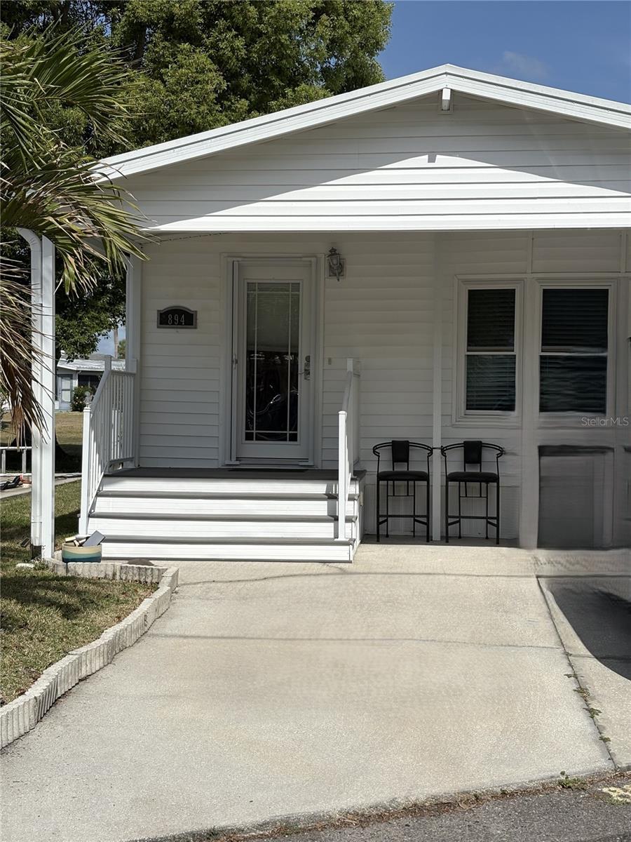 Great opportunity to own a beautifully maintained, fully furnished 2-bedroom, 1.5-bath home overlooking the golf course in the gated community of Outdoor Resorts of Orlando! Ideally located near world-famous attractions, including Disney (just 6 miles away), Universal Orlando, and SeaWorld, this home offers the perfect combination of comfort, convenience, and resort-style living.
Step inside to a bright and welcoming open living and dining area filled with natural light. The spacious kitchen features plenty of cabinet storage and counter space, making meal preparation a pleasure. The primary bedroom offers built-in closet storage, while the versatile second bedroom is currently configured as an office and easily transforms into a guest room with its convenient Murphy bed.
Outdoor Resorts of Orlando is a highly sought-after 55+ gated community offering an exceptional lifestyle with access to Lake Davenport, multiple swimming pools, shuffleboard courts, a 9-hole chip-and-putt golf course, tennis and pickleball courts, and an active clubhouse featuring entertainment, social events, Bingo, and much more.  Whether you're looking for a seasonal retreat, full-time residence, or vacation getaway, this move-in-ready golf course home is a must-see!
