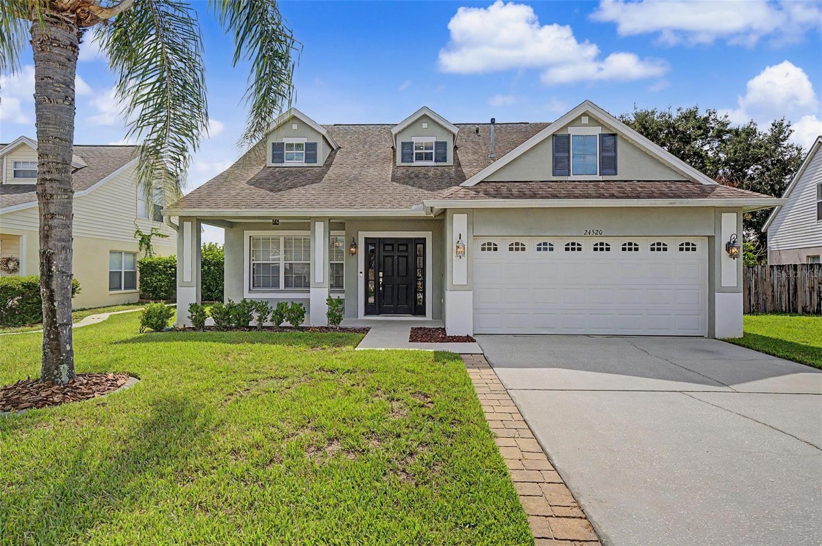 POOL HOME | 4 BEDROOMS + LOFT | FIRST-FLOOR PRIMARY SUITE | FENCED YARD | WELCOME TO ONE OF OAK GROVE'S MOST DESIRABLE POOL HOMES!  Nestled within one of Lutz's most sought-after communities, this beautifully maintained 4-bedroom, 2.5-bath residence offers outstanding curb appeal, a fantastic family-friendly layout, and the Florida lifestyle buyers dream about.  Step inside to discover a spacious floor plan designed for both everyday living and entertaining.  The oversized family room serves as the heart of the home, providing plenty of space for gathering with family and friends while flowing seamlessly into the kitchen and dining areas.  The well-appointed kitchen features granite countertops, stainless steel appliances, abundant cabinetry, a center island, and views of the backyard and pool, making it the perfect place to cook, entertain, and stay connected with family.  The first-floor primary suite offers a private retreat with a spacious bedroom, walk-in closet, and ensuite bathroom featuring dual vanities and a large walk-in shower.  Upstairs, you'll find a large, versatile loft that can easily function as a second living area, media room, game room, playroom, home office, or study space.  Three generously sized bedrooms and a full bathroom complete the second floor, creating the ideal layout for growing families or guests.  Step outside and enjoy your own backyard oasis featuring a sparkling screened saltwater pool, expansive paver lanai, and fully fenced yard.  Whether you're hosting pool parties, grilling with friends, or simply unwinding after a long day, this outdoor living space was designed to be enjoyed year-round.  Oak Grove remains one of the area's most highly sought-after communities thanks to its welcoming atmosphere, low HOA fees, convenient location, and proximity to highly rated schools, shopping, dining, and major commuter routes.  Homes in this neighborhood are consistently in demand because of the exceptional combination of location, community, and value.  For added peace of mind, the home features a roof replaced in 2019, HVAC system replaced in 2022, and water heater replaced in 2024.  If you've been searching for a move-in-ready pool home with space for everyone, a flexible floor plan, and a location that's hard to beat, this Oak Grove gem deserves a place at the top of your list.