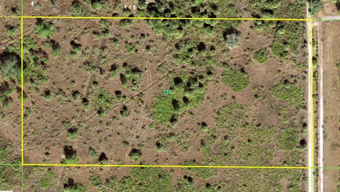 The concept of the Florida frontier evokes images of untouched landscapes, rich historical tapestries, and an enduring spirit of self-reliance. Located in the back section of the Golden Ranches subdivision in eastern Charlotte County, Florida, "High Prairie Acres" stands as a premier example of this timeless appeal. A remote five-acre parcel adjacent to an expansive mitigation ranch, High Acres represents a unique sanctuary for those seeking to immerse themselves in a traditional, off-grid agricultural lifestyle. The surrounding prairies were historically traversed by Spanish conquistadors and the indigenous Calusa Tribe.  In later centuries, renowned Western artist Frederic Remington and legendary Florida cattlemen like Bones Mizell ranged the area. Records indicate the five-acre tract has never been cleared or farmed, save for range cattle that grazed the land many decades ago. Today, it remains a pristine fragment of the original Florida frontier.  The physical characteristics and local infrastructure of Golden Ranches further emphasize its isolation and suitability for self-sufficient living. Golden Ranches spans a 1,280 acre area characterized by scattered, small ranchettes and undeveloped parcels, predominantly held by out-of-state property owners. Situated at a comfortable elevation of 50 to 60 feet above sea level, High Prairie Acres features native Florida flora, including scattered pines, a few oaks, and palmetto. Access to the property is dictated by private, owner-maintained dirt and marl roads featuring basic ditching. Because there is no formal Property Owners Association (POA) or county maintenance, infrastructure upkeep relies entirely on neighborly cooperation. Furthermore, the land lacks immediate access to municipal power lines, necessitating the use of solar arrays or generator systems, alongside the installation of private septic and well.  Despite its lack of modernization, the property offers unparalleled freedom due to its favorable regulatory environment and recreational potential. High Prairie Acres features no deed restrictions and is governed strictly by Charlotte County's Agriculture (AG) zoning district guidelines. This classification is explicitly designed to safeguard rural privacy and support agricultural operations by limiting residential development to a low density of one home per parcel. This flexible zoning accommodates a wide range of rural endeavors, from conservation projects and traditional farming to seasonal recreation. Depending on the time of year, residents can engage in outdoor activities such as ATV riding, fishing, and seasonal hunting activities on neighboring state game and private preserves.  Free from the light and noise pollution of nearby cities—evidenced by the fact that the nearest homes are many lots away—the property serves as a blank canvas for the imagination. The vivid sunrises, sweeping sunsets, and unobstructed views of millions of stars offer a dramatic visual display that rivals the works of the great artists who once drew inspiration from the region. For individuals who understand and desire the quietude of a rural lifestyle, High Prairie Acres stands as an exceptional opportunity to build a personal legacy on the historic Florida prairie.