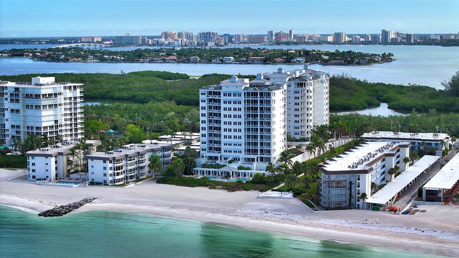 Introducing an Exceptional Beachfront Condo on Lido Key
The rarely available Cayman model in The Orchid Beach Club can become your beachfront bliss. Embrace the coastal lifestyle in a home that offers both luxury and comfort. 
This dream condo awaits in unit 301 ~ 4229 sq ft of living space and over 726 sq ft of terrace make this floorplan a coveted one.
Nestled on the pristine shores of Lido Key, this exquisite 3 bedroom, 4.5 bath beachfront property is everything you would want for luxury living. 
With expansive terraces that capture the breathtaking beauty of both the Gulf of Mexico to the west and the serene Sarasota Bay to the east, you can relish in the magic of both sunsets and sunrises while relaxing in your own home.
A private elevator whisks you effortlessly to your home.
The unit's open floor plan creates an inviting and seamless flow, with a grand salon and adjacent TV area providing a perfect space for relaxation. A separate dining area, harmoniously connected to the open kitchen, makes entertaining a breeze. The elegant lighting fixtures, including beautiful chandeliers, illuminate the space, accentuating the soaring ceilings that lend an air of grandeur.
The master bedroom suite is a true sanctuary, featuring a cozy den, his and her baths, his and her walk-in closets and a most spacious bedroom that looks out on the Gulf of Mexico.
Parking is a breeze with a spacious 2-car garage that provides plenty of space for storage, keeping your belongings organized and accessible.
Orchid Beach Club, a community that exemplifies luxury beachfront living and boasts a beautiful clubhouse. Here, you'll enjoy an array of amenities designed to enrich your coastal lifestyle, from a well-equipped exercise and fitness room to meeting and party rooms featuring a chef's kitchen, a library and a billiard/game room – perfect for hosting gatherings with friends and family. Beautifully appointed guest suites are available for your loved ones when they come to visit, ensuring their comfort and convenience.
The stunning pool area reminiscent of a private resort serves as a serene sanctuary for residents. Immerse yourself in the sparkling waters, soak up the Florida sun on the expansive pool deck, or unwind in the soothing spa ~ all while overlooking the Gulf of Mexico.
Minutes away from both Saint Armand’s Circle and downtown Sarasota, you'll find yourself immersed in a vibrant cultural scene, upscale shops, and world-class dining. 
This is more than a home; it's a lifestyle – an opportunity to embrace the serene beauty of Lido Key, to savor the luxury of Orchid Beach Club, and to enjoy  the vibrant culture of Sarasota. Make this beachfront masterpiece yours today and experience the pinnacle of coastal living.