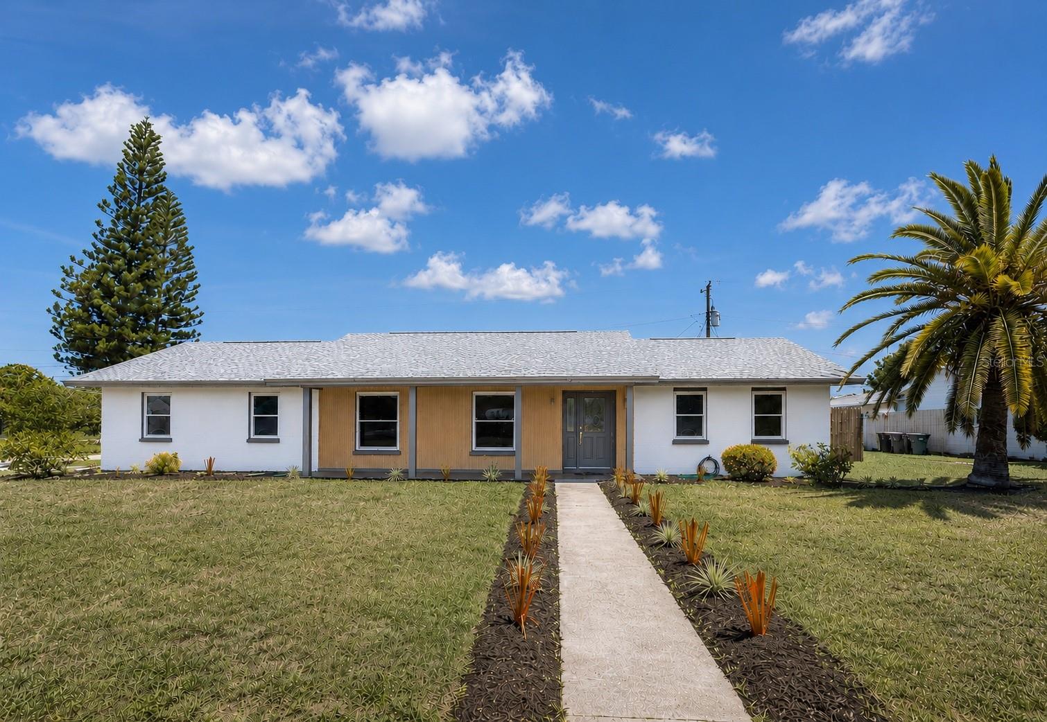 Where timeless design meets modern coastal living, this beautifully reimagined residence has been thoughtfully renovated from top to bottom and is perfectly positioned on an oversized corner lot, just minutes from the world-renowned beaches of Anna Maria Island.

Offering 3 bedrooms, 2 bathrooms, and a spacious primary suite complete with a walk-in closet, this home was designed with both style and functionality in mind. The expansive open-concept floor plan creates an inviting atmosphere, with the living room, dining area, and kitchen flowing seamlessly together. Perfect for everyday living and entertaining alike.

At the heart of the home is a truly exceptional kitchen featuring white shaker-style cabinetry finished with elegant crown molding, a striking navy blue island, and timeless finishes that perfectly capture today's sought-after modern coastal aesthetic.

Thoughtfully designed for everyday convenience, the home also features a large laundry room and ample storage throughout, offering the perfect balance of beauty and practicality.

Step outside and embrace the Florida lifestyle you've been dreaming of. The sparkling pool, large fenced backyard, and generous outdoor space create the ideal setting for relaxing, entertaining, and enjoying year-round sunshine. A two-car garage adds convenience, while the oversized lot provides a sense of space and privacy rarely found.

Whether you're searching for a full-time residence, seasonal retreat, or investment opportunity near the Gulf beaches, 3810 18th Avenue W. delivers the perfect blend of location, style, and lifestyle.