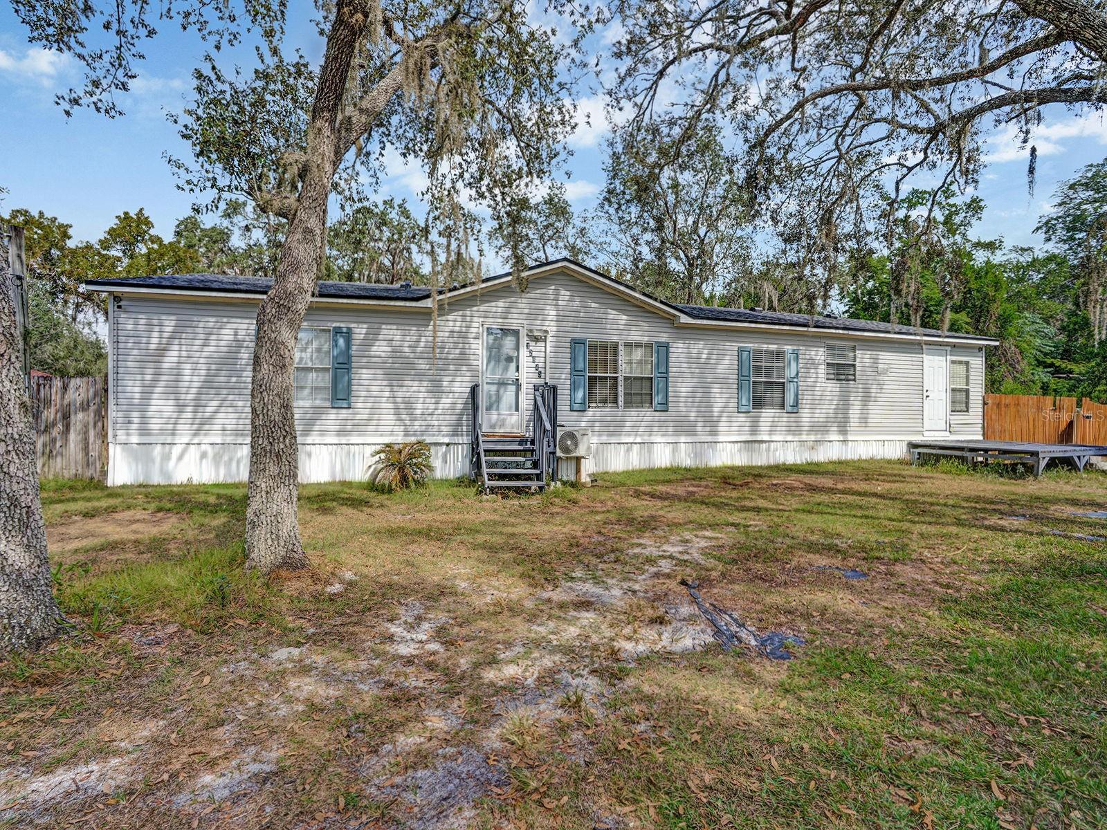 Welcome to this beautifully renovated retreat in the heart of New Port Richey! Situated on a sprawling .75-acre fully fenced lot, 12845 Casa
Bianca Dr offers the perfect blend of privacy, flexibility, and modern comfort. Conveniently located between Casa Bianca Ave and Back Bay Ave, the property features dual street access for added convenience and versatility. This move-in-ready home features 3 spacious bedrooms and 3 full bathrooms, along with a bright open-concept floor plan designed for comfortable everyday living and effortless entertaining. Recent upgrades include new flooring throughout, updated bathroom vanities, freshly painted decks and doors, and a beautifully renovated kitchen complete with stainless steel appliances, stunning countertops, and abundant cabinet space. Major system updates provide peace of mind, including a new roof and central A/C installed in 2022. In addition, each room is equipped with its own mini-split A/C unit for customizable comfort year-round. Step outside and enjoy the endless possibilities of this expansive AR-zoned property— with no HOA and no CDD restrictions. The fully fenced yard includes a new storage shed and a gated dog run, making it ideal for pet owners, outdoor enthusiasts, or anyone needing extra space for toys, hobbies, or future expansion. Located a short walk to Moon Lake Park, residents can enjoy access to a boat ramp, lakeside beach, playground, and scenic outdoor recreation. Plus, shopping, dining, and everyday conveniences are just a short drive away. Offering the charm of modern updates with the freedom of a large private lot, this exceptional property is ready to welcome you home. Schedule your private showing today!
