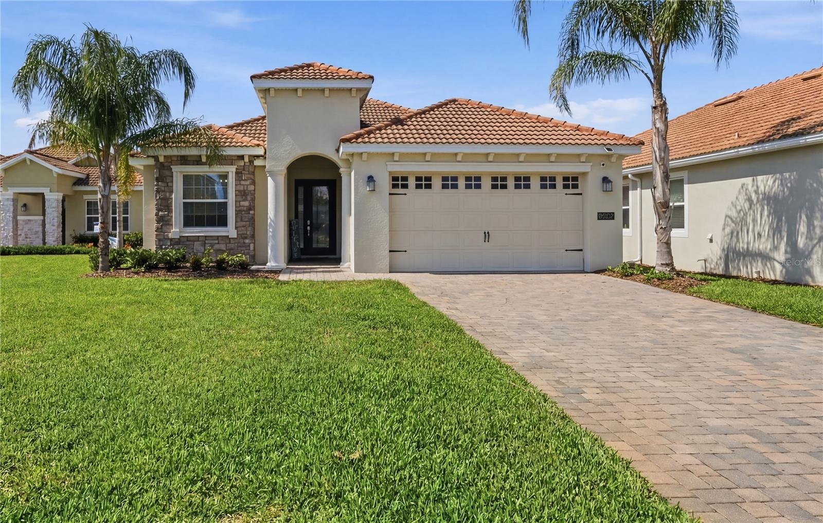 Welcome to this stunning 4-bedroom, 2-bathroom pool home nestled in the exclusive, gated Country Club at Champions Gate. This is a true TURNKEY property — fully furnished and beautifully decorated, ready for you to move in from day one. Simply bring your suitcase.
The home features ceramic tile throughout three bedrooms and living areas, with plush carpet in the fourth bedroom. Every detail has been thoughtfully curated, and all furnishings are included in the sale.

The property also features an oversized driveway that can accommodate up to 4 full-size pickup trucks — larger than all other homes on the street.
The backyard is an entertainer's dream. The custom-built heated saltwater pool and inground spa feature color LED lighting, controlled effortlessly through a WiFi smart automation system. Surrounded by panoramic screens that preserve every inch of the stunning pond view, this oasis is as beautiful by night as it is by day. A Paradise Grills outdoor bar completes the picture, with a built-in grill, refrigerator, bar stools, and integrated speakers — perfect for hosting under the Florida sun.
Country Club homeowners enjoy access to three exceptional amenity centers: *The Plaza, a private owners-only clubhouse with a restaurant, bar, two pools, spa, sauna, and gym; **The Oasis Club, a 16,000 sq ft resort clubhouse with pools, lazy river, water slide, splash zone, movie theater, arcade, and Tiki Bar; and the **Retreat Club, just a short walk from the property, featuring water slides, splash pad, resort pool, and mini golf. Golf lovers will enjoy the bundled membership to the *18-hole championship golf course — just pay cart fees. The HOA covers lawn care, cable, internet, and gated security for a truly maintenance-free lifestyle.
Ideally located minutes from I-4, world-class dining, shopping, and Central Florida's top attractions. This is not just a home — it's a lifestyle!

Request your private tour, do not miss the opportunity to have your Florida Dream Home