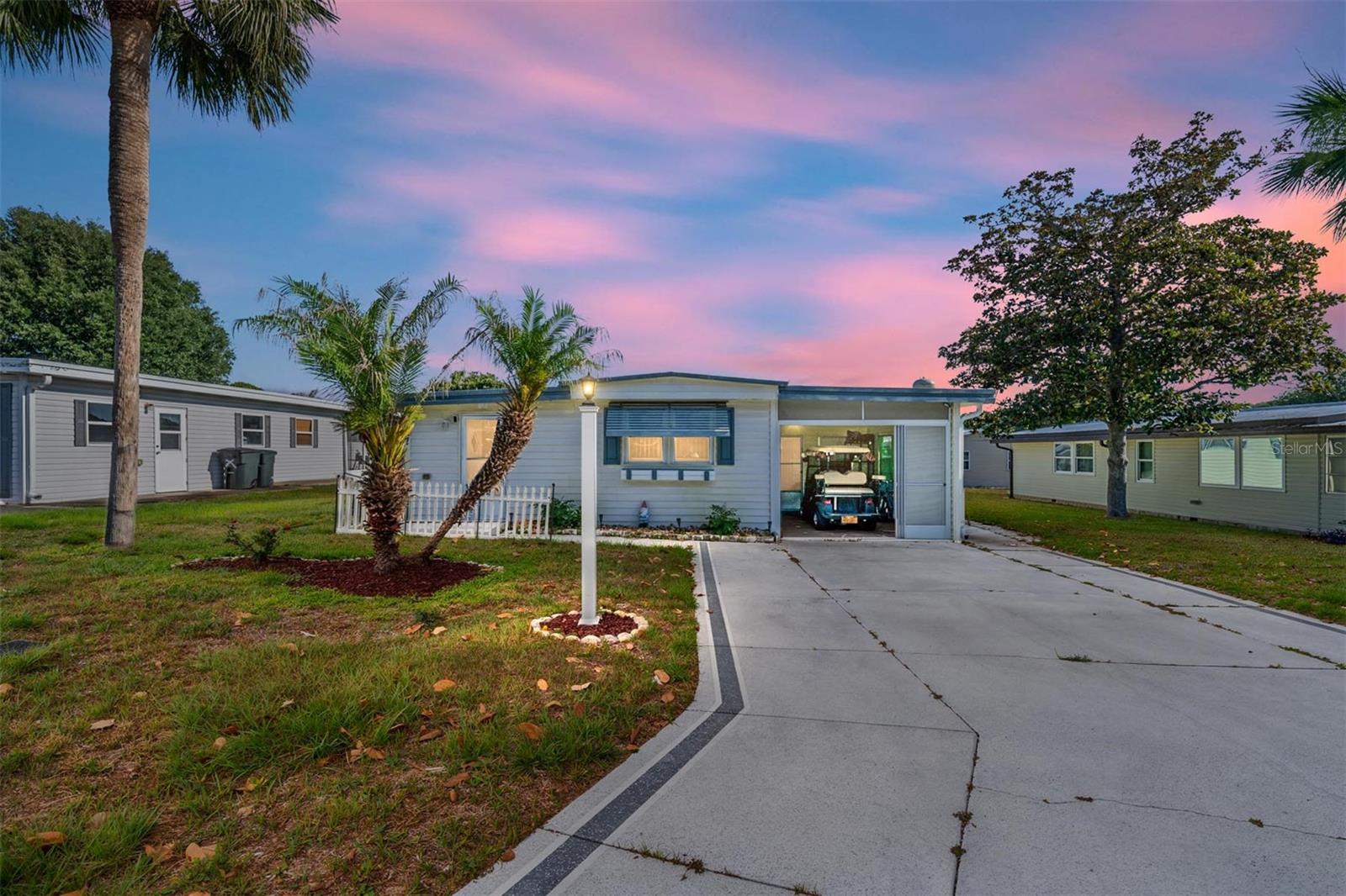 Step into your new home in the prime and desirable Villages Community! This No Bond home is located in the
Orange Blossom Gardens district. It is a Three bedroom, Two bathroom, 1,335 sqft home that features a sun room and screened in
patio. In addition to these rooms, the home boasts of ample storage space, with an updated HVAC, and a Golf car garage that
includes your cart awaiting you for all journeys! This home comes furnished, move-in ready and grants you nearby access to the
Mark Twain library, Chapel of All faith, Paradise Regional pool and recreation center, Orange Blossom Hills Country club, Paradise
dog park, a view of the Hill top Golf course and lake from your backyard but most importantly, a golf cart ride near to the popular
Village center which hosts a plethora of shops, restaurants and spaces for entertainment! If you're looking for a home that is in a
great location, peaceful, ideal for vacation, and beautiful enough to make your own, consider yourself a Villager and make this your
HOME!