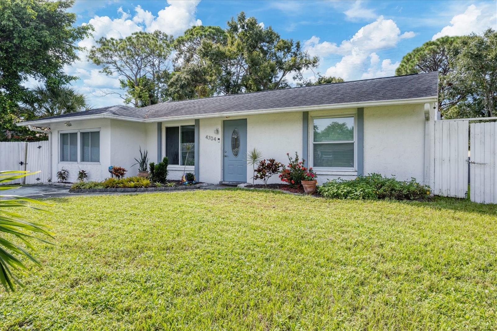 Fully remodeled and move-in ready! This charming one-story home offers comfort and style. Step inside to an inviting great room that flows into the large dining area. French doors with between-the-glass shades open to the patio and large back yard. Enjoy the modern kitchen, featuring ample storage in the beautiful cabinetry with expandable pantry, a double oven and a breakfast bar—perfect for casual dining or entertaining guests. The owner’s suite is a private retreat with two spacious closets and an ensuite bathroom complete with an updated vanity and sleek shower. Additional updates throughout the home ensure a fresh, modern feel in every room. Outside, enjoy a fully fenced yard—ideal for outdoor gatherings, pets, and there is room for a pool. No HOA, No CDD's and Not in flood zone! Conveniently located near beautiful beaches, shopping, and dining and walkable to school, this home truly has it all.