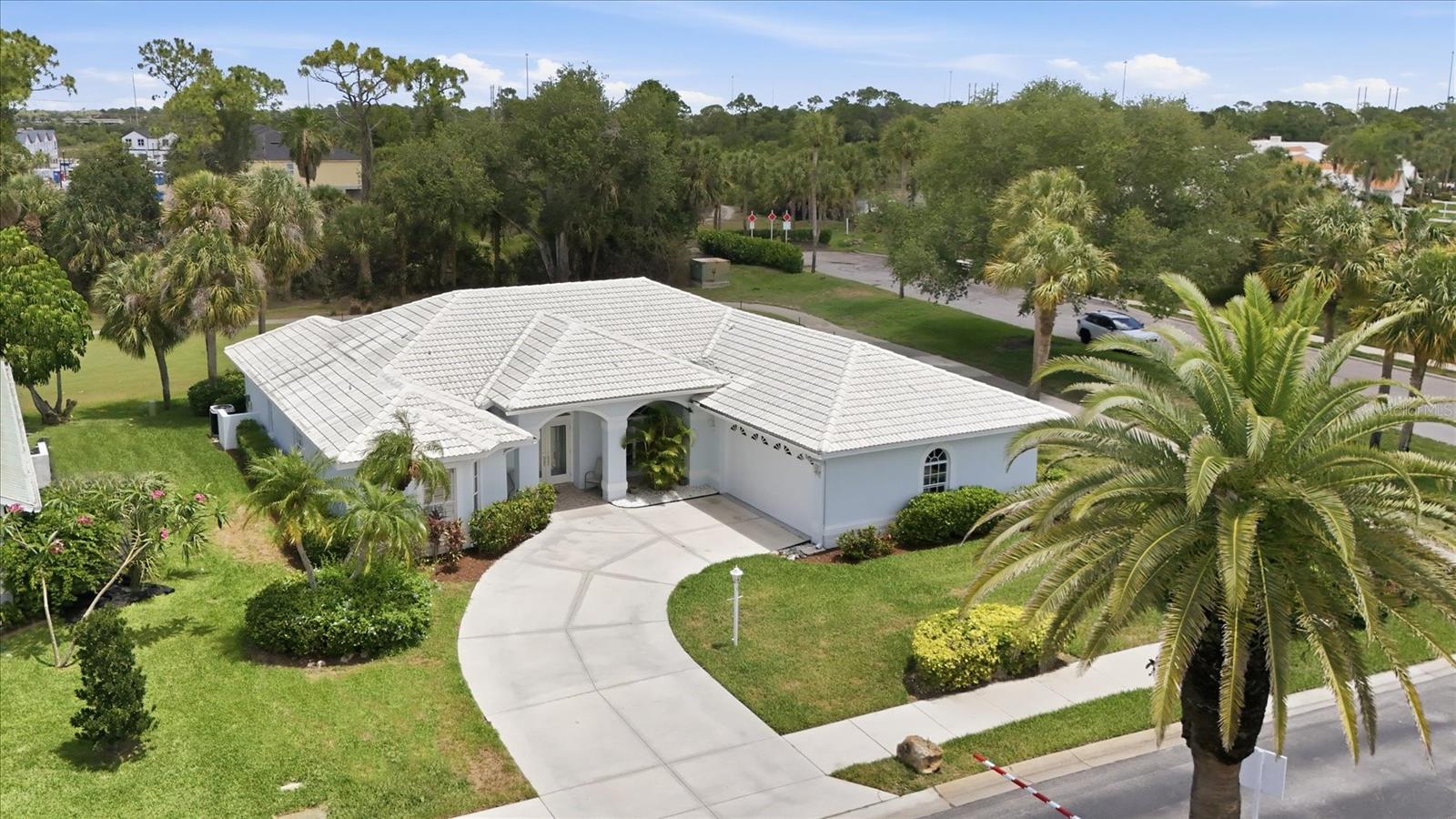 Welcome to Golf Course living in the highly sought after community of Waterford. Located on the North side of Venice near Venice historic downtown, Venice Beach, Legacy Trail and the new Sarasota Memorial Hospital. Waterford living boasts resort-style amenities with an updated clubhouse, state of the art fitness center, Junior Olympic size pool, library, Har-Tru tennis courts, pickleball courts, and optional golf membership on a semi-private 27-hole championship course with a pro shop, putting green, driving range and restaurant. This beautiful home is located on a corner lot with the popular floorplan boasting multiple rooms that include a formal dining room, a front sitting room, the living room and a bonus area for the hobbyist in you. In addition, the split floorplan provides privacy for your guests with a pocket door leading to the guest wing with two of the bedrooms, and a bathroom that also has access to the pool area. The fourth bedroom could be used as a den/office and is located towards the front of the home with beautiful bay windows. Natural light abounds with the vaulted ceilings and 3 sliding glass doors. The extra-large primary bedroom, with ample space for a sitting area, dual closets, multiple windows, and sliding doors that lead out to the pool and a large primary bathroom with dual vanities, and a separate tub/shower. The screened in lanai includes a covered porch area, perfect place to sit in the early morning with a cup of coffee or evening outdoor dining.  Come and enjoy golf course living in sunny Florida!