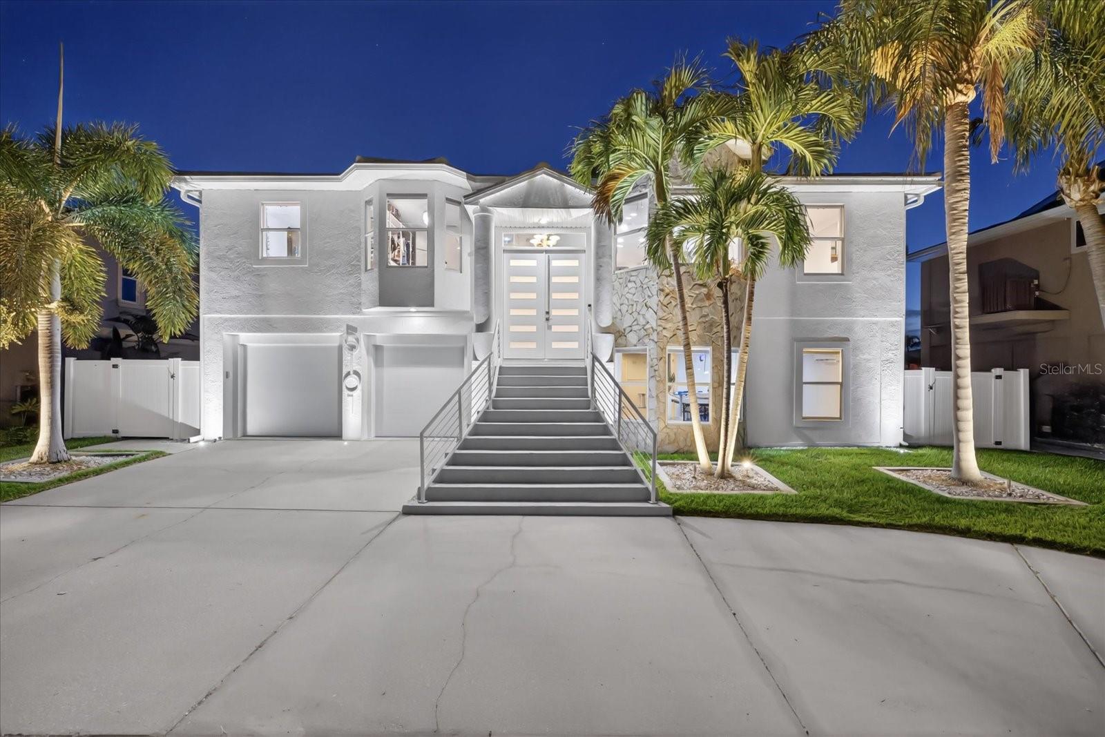 If you’ve been searching for a Gulf access home in Florida with a pool, boat lift, and direct water access… this is the one that checks every box. Welcome to 5101 South Shore Drive. This elevated 3-bedroom, 3-bathroom waterfront home with direct Gulf access is perfectly positioned on a deep and wide saltwater canal in the highly desirable Gulf Harbors community of New Port Richey, Florida with breathtaking sunset views right in your back yard. Your entire first level is dedicated to a spacious two-car garage, a full bathroom, and an oversized flex space—ideal for a home gym, media room, office, or additional entertaining area.

Upstairs, the main living area opens up with soaring vaulted ceilings, an open floorplan and lots of natural light. The true showstopper is the beautifully designed kitchen featuring a  extra long quartz waterfall island, five-burner cooktop, drawer microwave, Samsung refrigerator, pull-out pantry with deep drawers, under-cabinet lighting, and a reverse osmosis water system. A cozy wood-burning fireplace with updated modern tile dressed to the ceiling in the living room completes the modern design. With all tile floor throughout the upper level. 

The primary suite is a true retreat, offering a private covered deck that extends to the width of the home, overlooking the canal, pool, and dock, delivering the kind of peaceful waterfront views buyers are searching for in a Florida Gulf access home. There's plenty of storage space, with his and her closets, a linen closet, and an attached primary ensuite with elegant floating vanities, rainfall walk in updated shower, and a sleek frameless glass shower door. 

Built with comfort and peace of mind in mind, the home includes impact-rated dual-pane windows engineered for high winds, a smart thermostat, and automatic blackout blinds in the primary, blending efficiency with convenience.

The home also has a split floorplan with the other two bedrooms sharing the hall bath, and easy laundry access on the living level. This floor also features an office, that is currently being used as an additional closet, and a formal dining room. 

Step outside and you’ll find your own backyard oasis—complete with a heated saltwater pool with sun shelf, custom lighting, paver decking, and low-maintenance PVC dock. For boating enthusiasts, the private boat lift and floating dock provide direct access to the Gulf, making it easy to enjoy days on the water in mere moments! 

Located in the waterfront community of Gulf Harbors, residents have the OPTION to join the HOA for just $125 annually and gain access to a private beach club on the Gulf for only $200 per year, featuring cabanas, grills, and some of the best sunset views on Florida’s west coast. With golf cart-friendly streets and a full calendar of local events, this neighborhood offers both lifestyle and value.

Whether you’re looking for a primary residence, second home, or waterfront investment property with Gulf access, this home delivers the features, location, and the modern lifestyle that define Florida coastal living.