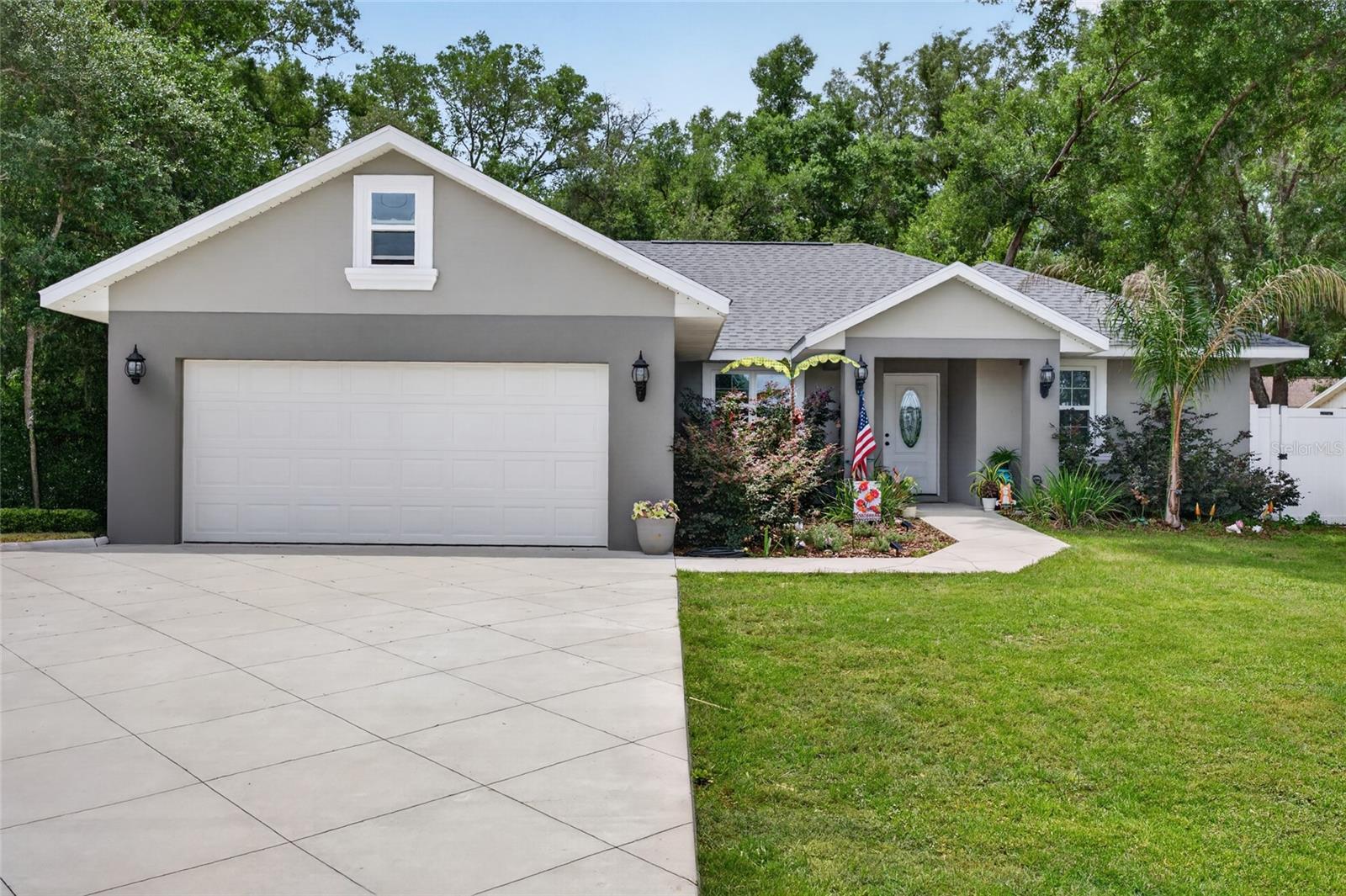 Why pay monthly fees and deal with strict rules when you can have it all on your own terms? Built just a few years ago, this stunning home offers the perfect blend of pristine condition, and ultimate freedom. Nestled on a premier, oversized private lot, this property is a rare find in today’s market. The expansive, fully fenced backyard serves as your own secure oasis, offering unlimited potential for pets, gardening, or storing your outdoor recreational toys without an HOA looking over your shoulder. Step inside to find an elegant interior highlighted by soaring tray ceilings that create an immediate sense of grand volume, open space, and bright, airy comfort. The heart of the home features a kitchen complete with gleaming granite countertops throughout, ample cabinetry, and a layout designed for effortless entertaining and everyday living. Beyond the property line, you will enjoy the absolute best of both worlds. You are just a short, convenient drive from the world-class dining, shopping, golf courses, and nightly live entertainment of The Villages, while still getting to return home to your own peaceful, private retreat. Avoid the cookie-cutter neighborhoods and claim your slice of Florida freedom—schedule your tour today!