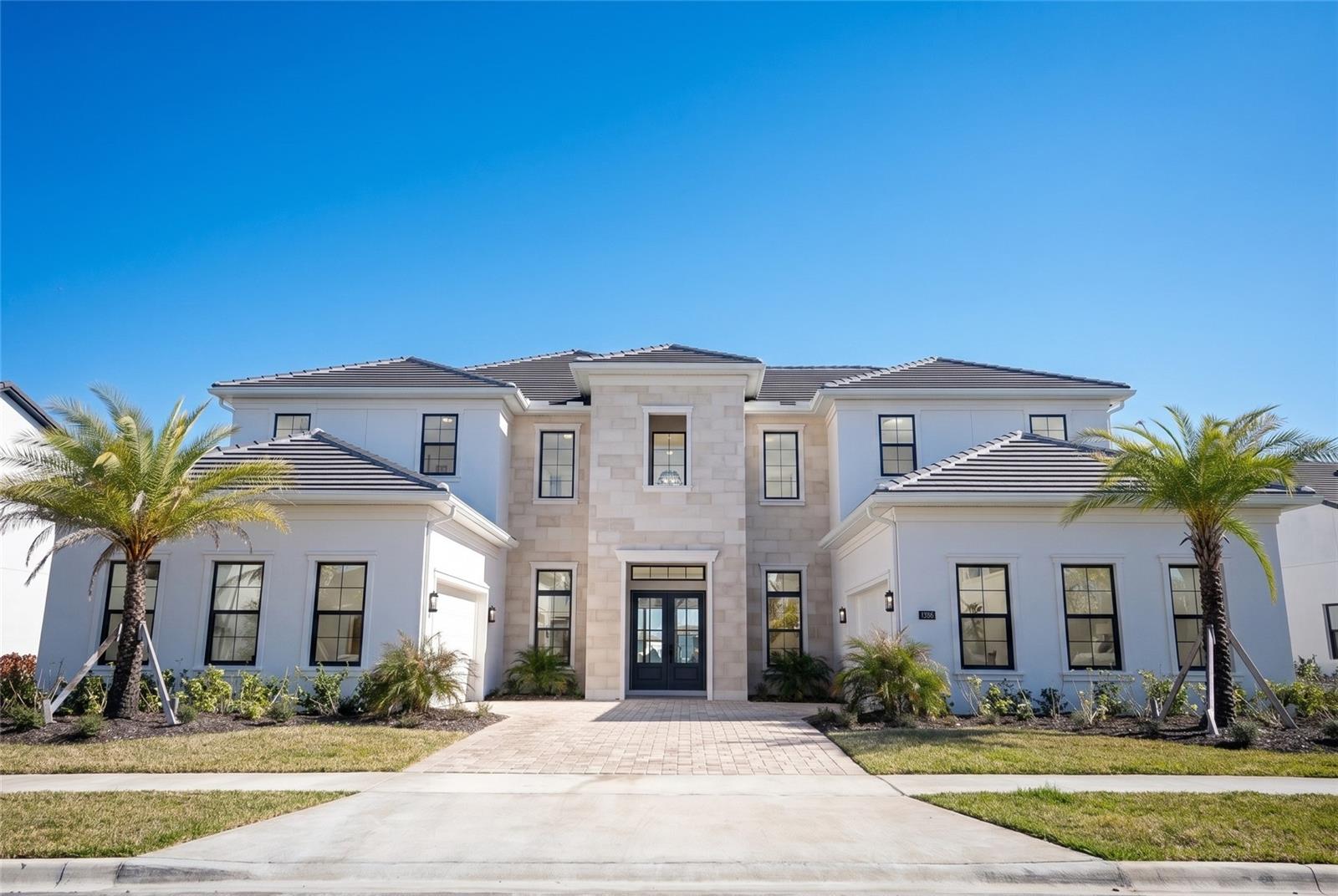 One or more photo(s) has been virtually staged. Introducing an extraordinary Toll Brothers lakefront masterpiece in the exclusive gated enclave of Laurel Pointe at Lake Nona.
Positioned on a premium waterfront homesite with a Northeast-facing front and a Southwest-facing backyard, this residence is perfectly oriented to capture soft morning light at the entrance and stunning afternoon sun over the lake, creating breathtaking golden-hour reflections across your future outdoor living space.
Spanning 6,632 square feet of contemporary elegance, this newly built estate showcases soaring ceilings, striking architectural lines, and an abundance of natural light throughout, with no carpet anywhere in the home. Every detail was curated for refined modern living.

Featuring 5 spacious bedrooms, a dedicated cabana bath ready for future pool enjoyment, and two private office spaces, one downstairs and one upstairs, this home was designed for today’s lifestyle. Whether managing business remotely, hosting executive meetings, or creating family memories, the layout offers both productivity and privacy.

The open-concept design flows seamlessly into a covered lanai overlooking serene lake views, where Southwest exposure enhances your afternoons with warm, inviting sunlight ideal for entertaining, relaxing, or designing the ultimate outdoor retreat.

At the heart of the home, the chef’s kitchen impresses with premium appliances, an oversized island, sleek custom cabinetry, and designer finishes, all opening to expansive dining and living areas that elevate both everyday living and large-scale gatherings.

The primary suite is a private sanctuary with tranquil water views and a spa-inspired bath featuring a freestanding soaking tub, oversized glass shower, dual vanities with smart mirrors, and curated luxury finishes.

Additional highlights include a private theater room for cinematic evenings, energy-efficient systems, dual 2-car garages, and generous storage throughout.

Located in Lake Nona’s innovative master-planned community, residents enjoy proximity to Medical City, USTA National Campus, Orlando International Airport, and premier dining and shopping, all within one of Central Florida’s most forward-thinking neighborhoods.
This is more than a home.
It’s a statement of lifestyle, design, and position.
Schedule your private showing today and experience elevated lakefront living at its finest.