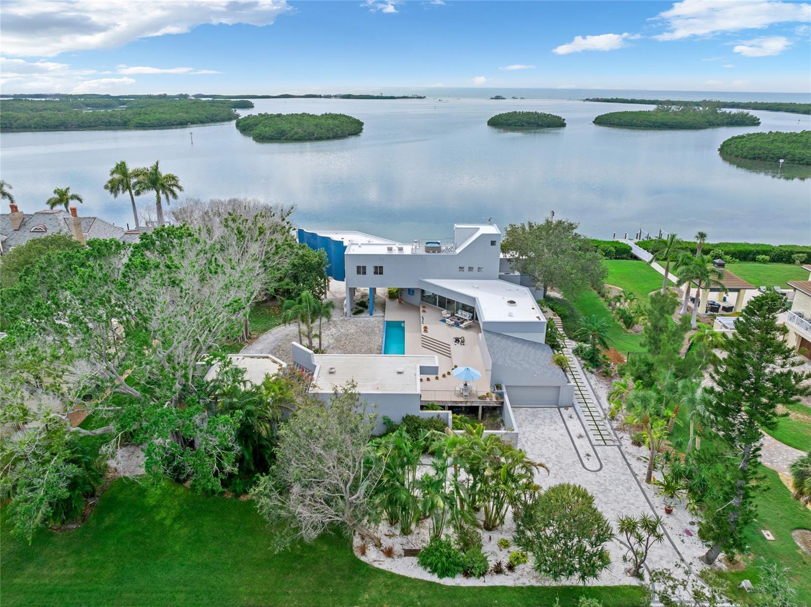 Enjoy modern coastal living on your own private waterfront beach with exquisite, unobstructed open water views of the Gulf of Mexico.