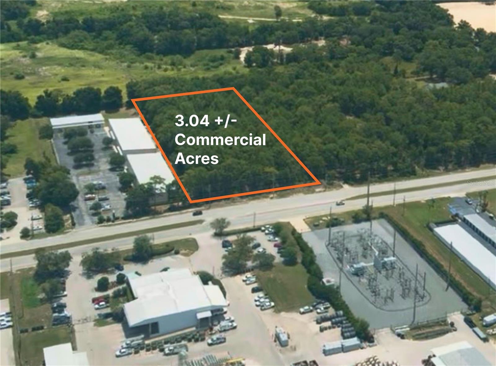 3.04-acres of fully entitled commercial infill site with a Major Site Plan stamped by Burrell Engineering, Inc. (Parcel ID 23834-001-11). The site is zoned PUD with an Employment Center (EC) land use designation and is approved for 47,143 gross square feet across four modular buildings (A, B, C, D). City of Ocala water and sewer are verified at the property line, eliminating the need for off-site utility extensions. The approved plan allows ground-floor retail, upper-level storage/garage flex space, and restaurant use with an engineered grease and oil separator layout, along with a 24-foot cross-access easement and 94 parking spaces, well above county minimums. Two years of engineering, drainage, zoning, and utility review are already complete, cutting an estimated 18 to 24 months off a buyer's speed to market.