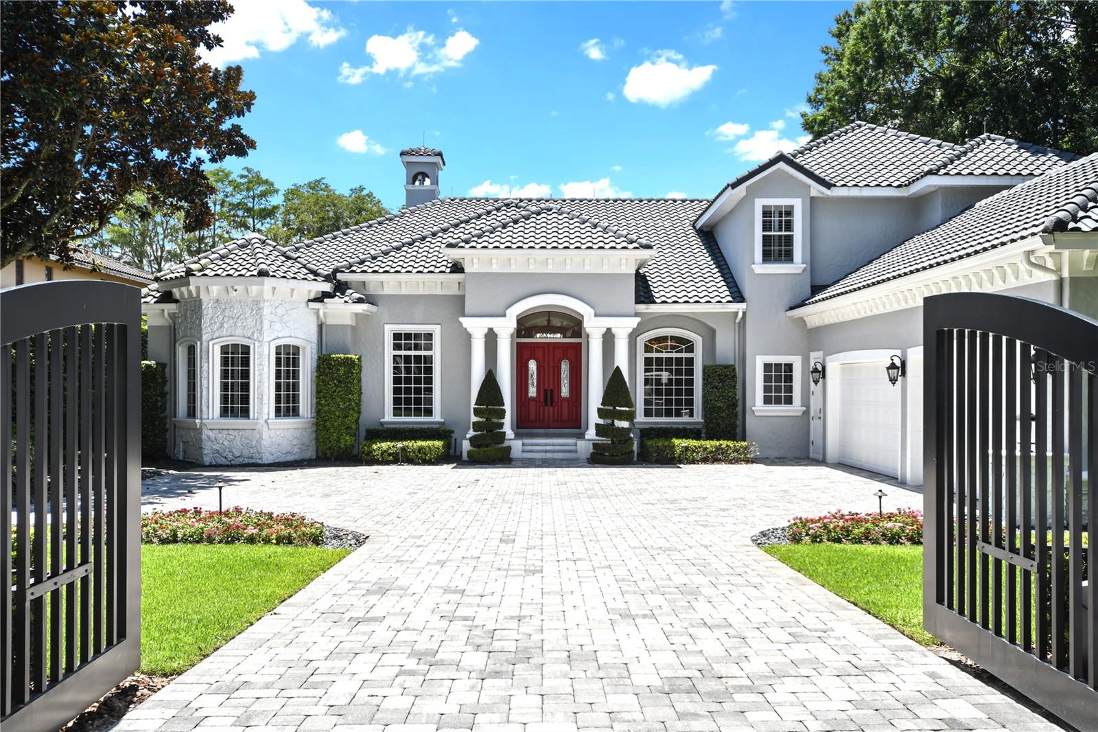 Welcome to 5000 Down Point Lane in Windermere, a luxurious retreat situated on 2 acres of pristine lakefront property. This entirely renovated home offers breathtaking sunsets over Sunset Bay, providing a picturesque backdrop for daily living.

The master suite, office, entertainment room and an additional suite are conveniently located on the main floor, while three more bedrooms and bonus room are upstairs. Cozy up by the fireplace in the spacious living area, or enjoy the elegance of Italian porcelain flooring throughout the home.

Outdoor living is elevated with a large pool patio and entertainment area, complete with a summer kitchen. The expansive grassy yard leads up to your private beach and dock, perfect for enjoying the best of lakefront living. 

At just under 6,000 square feet, this home offers ample space for comfort and luxury. Don't miss the opportunity to own this spectacular property in Windermere.