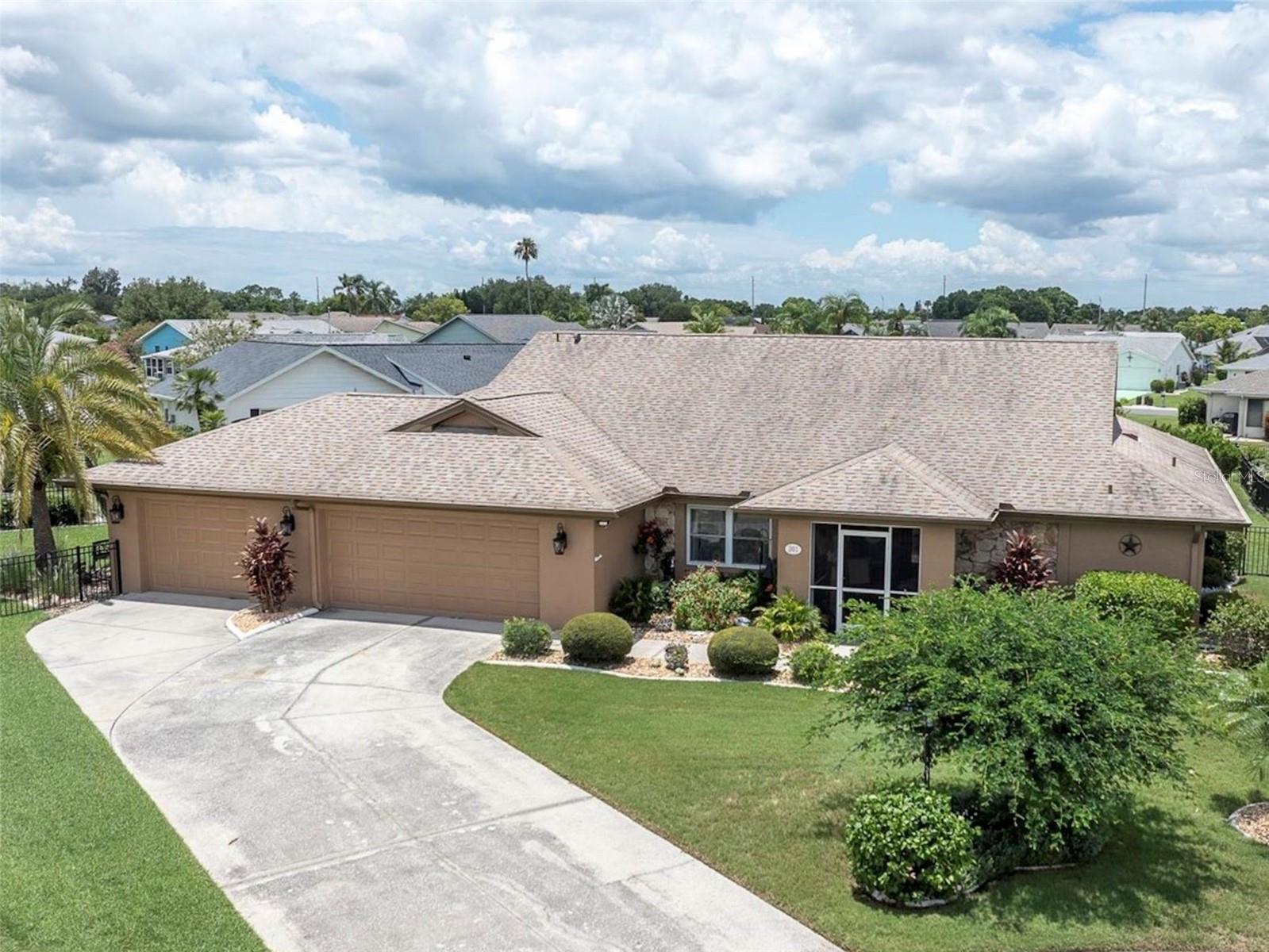 55+ resort-style living at Sun City Center - ranked #1 retirement town in the US! 
Well-maintained POOL HOME located at the end of a low traffic cul-de-sac in St Andrews Estates. This 3 bedroom, 2 bathroom and 3 CAR GARAGE home has 2400 sq ft of living space! Enter through the front door into the living room with pocket sliding glass doors, merging the interior and exterior spaces together. Enjoy peaceful relaxation in your personal oasis - a large covered patio, with wet bar, screened-in private pool with built in spa. Lush landscaping and palm trees in the fenced backyard add to the tranquility of this property. 
To the left of the front door is the dining area, currently used as an additional seating area.
Enter into a spacious primary suite with a sliding glass door for private access to the lanai and pool. The recently remodeled ensuite bath has double sinks and an oversized shower with built-in seating that is wheelchair accessible. 

The kitchen boasts beautiful granite counter tops, a breakfast bar and pantry. Just off the kitchen is the cozy family room - a great space for enjoying your favorite movies! Pocket sliding glass doors create a seamless space between the family room and lanai for quick pool access! 

Split floor plan for privacy! There are two additional bedrooms with an updated full bath located in-between. The second bedroom toward the back of the home is large enough to accommodate a king size bed. The versatile third bedroom (closest to the laundry room) was remodeled adding sq ftg – great as a bedroom with a seating area, office or use to your own personal taste. 

MANY UPGRADES: dimmer electrical switches throughout the home, all interior doors updated, all sliding glass doors have new rollers so glide easily, all lights & ceiling fans have been updated, walls have been re-textured to a knock-down finish, newer exterior paint, newer front door, garage addition (9/2007) - 3rd stall added, additional sq ftg 3rd bedroom (3/2008), new roof (2014), new water heater (2021), new pool heater (2021), new front door (2021), new AC (2024). *Water softener is leased* *Electric hurricane shutters on lanai*

No CDD Fees! Not in a flood zone! In this premier retirement community you’ll find many amenities and activities. At Sun City Amenity Center enjoy the pool, fitness center, lawn bowling, tennis courts, yoga center and more. Over 50 classes to choose from! There’s even a pickle ball court at the SCC Community Hall. Close to Tampa and Sarasota with easy access to beautiful gulf coast beaches, restaurants, shopping and airports! Enjoy the Florida lifestyle in this wonderful 55+ community!!