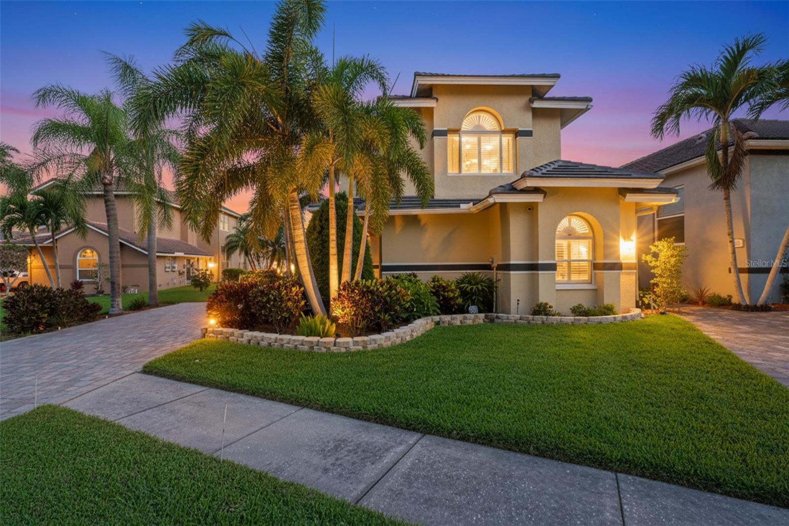 Tucked along 86 feet of saltwater canal frontage, this beautifully updated two-story single-family home blends waterfront living with everyday comfort. Featuring over 2400 sq. ft. of living space, this 3 bedrooms plus a loft, 2 full baths, 1 half bath, and a 2-car garage with additional storage area home offers both flexibility and function. The first-floor primary bedroom provides convenience and privacy with ensuite bathroom including custom double vanities, custom linen closet, freestanding soaking tub, separate shower and double closets with organizer systems. The designer kitchen showcases functionality and style with white cabinetry, stainless steel appliances and black matte granite countertops. Added bonus is the seller is offering a home warranty. Soaring ceilings, plantation shutters, and abundant natural light create an airy coastal feel throughout.  The outdoor space is designed for entertaining with a private pool, expansive deck, dock, and boat lift overlooking a fantastic water view. Lush tropical landscaping enhances the private retreat atmosphere.
Located in the exclusive gated waterfront community of Symphony Isles with 24-hour security, residents enjoy access to a private beach, boat launch, clubhouse, community pool, sand volleyball court, gazebo, picnic areas, and grilling stations. Coastal living with resort-style amenities awaits.