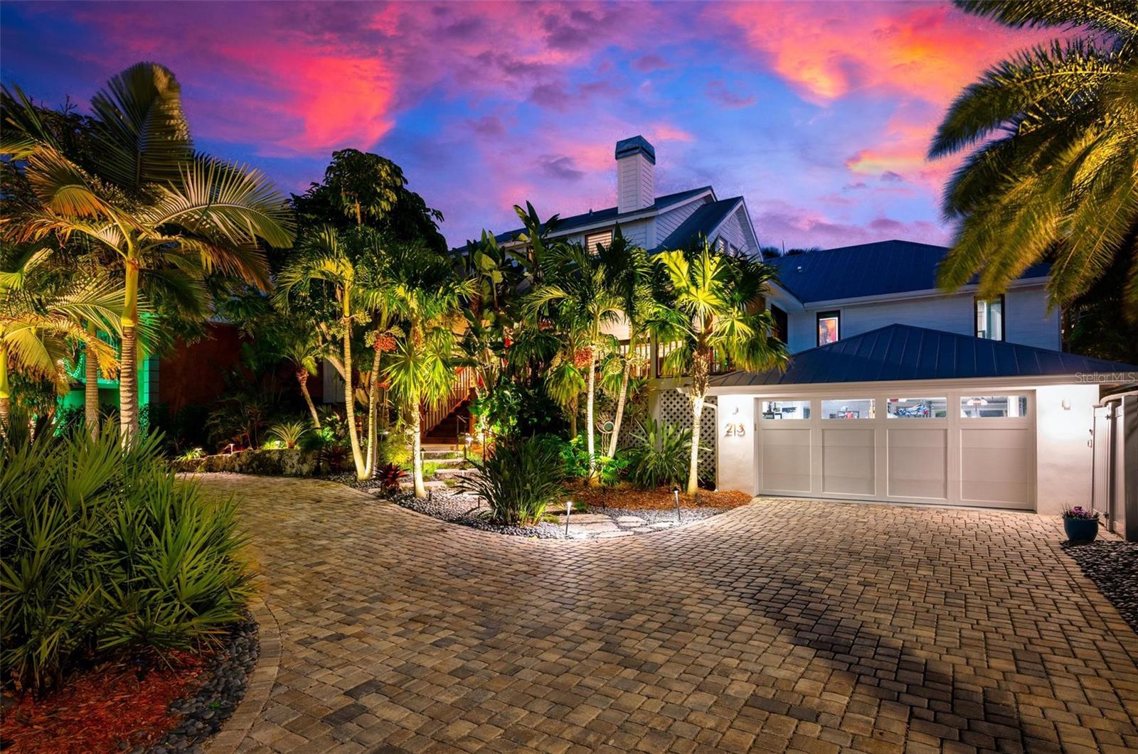 Experience Florida coastal living at its finest in this exceptional custom-built home featured in
Southern Living Magazine. Uniquely located, this house is a short walk to white sand beaches
and a short cruise to the Bay and Gulf. This classic Key West styled beauty was renovated and
enlarged four years ago.
The lush front yard features a circular paver driveway, a gorgeous Royal Poinciana tree, an
assortment of local palms and a majestic Canary Island Date Palm. The front walkway is cut
from limestone slabs, replicating ocean coral.
Featuring 4 bedrooms and 4 bathrooms this thoughtfully designed residence offers an open
floor plan filled with abundant natural light creating a bright and welcoming atmosphere
throughout with quality craftsmanship and timeless coastal style. Two screened porches and a
backyard deck invite indoor-outdoor living.
Inside the open floor plan features a bright spacious great room highlighted by a two-story
vaulted cathedral ceiling. A stylish granite-mantled fireplace with mermaid statues beautifies this
unique space. The adjoining dining room and kitchen offer granite countertops, stainless steel
appliances and customized cabinets.
The main suite’s spacious bedroom has well-appointed custom-built nightstands, bookshelves,
and a glass and mirrored-shelved head board. There is a walk-in closet and French doors leading
to the back deck with canal views. The ensuite tiled bathroom has a spa-like feel with an electric
toilet, separate dual sinks, granite countertops and a combined walk-in shower and steam room.
Another main floor suite has a tiled bathroom, a sit-down, walk-in Jacuzzi-styled tub, an electric
toilet and granite counter top. The upstairs bedroom extends the length on the second floor with a
tiled bathroom, a bathtub and shower.
The backyard is a tropical oasis complete with a Tiki Hut, a midnight- blue-bottomed resort-
style pool trimmed with natural stone, a waterfall, a bronze dolphin fountain, a hot tub, an
enclosed hot-water outdoor shower, and old growth Coconut, King, Sable, Bismark, Foxtail, and
Christmas palm and giant bird-of-paradise trees.
Situated on the canal is a forty-seven foot wooden dock and boat lift, allowing direct water
access via Bimini Bay and Anna Maria Sound to open waters and endless water adventures.
A spacious multi-car garage provides plenty of room for stowing bikes, golf carts, and beach
gear.
Just a short stroll to the sugar-white sand beaches, this picturesque property is perfectly
located to enjoy the beach, the bays and Gulf waters.