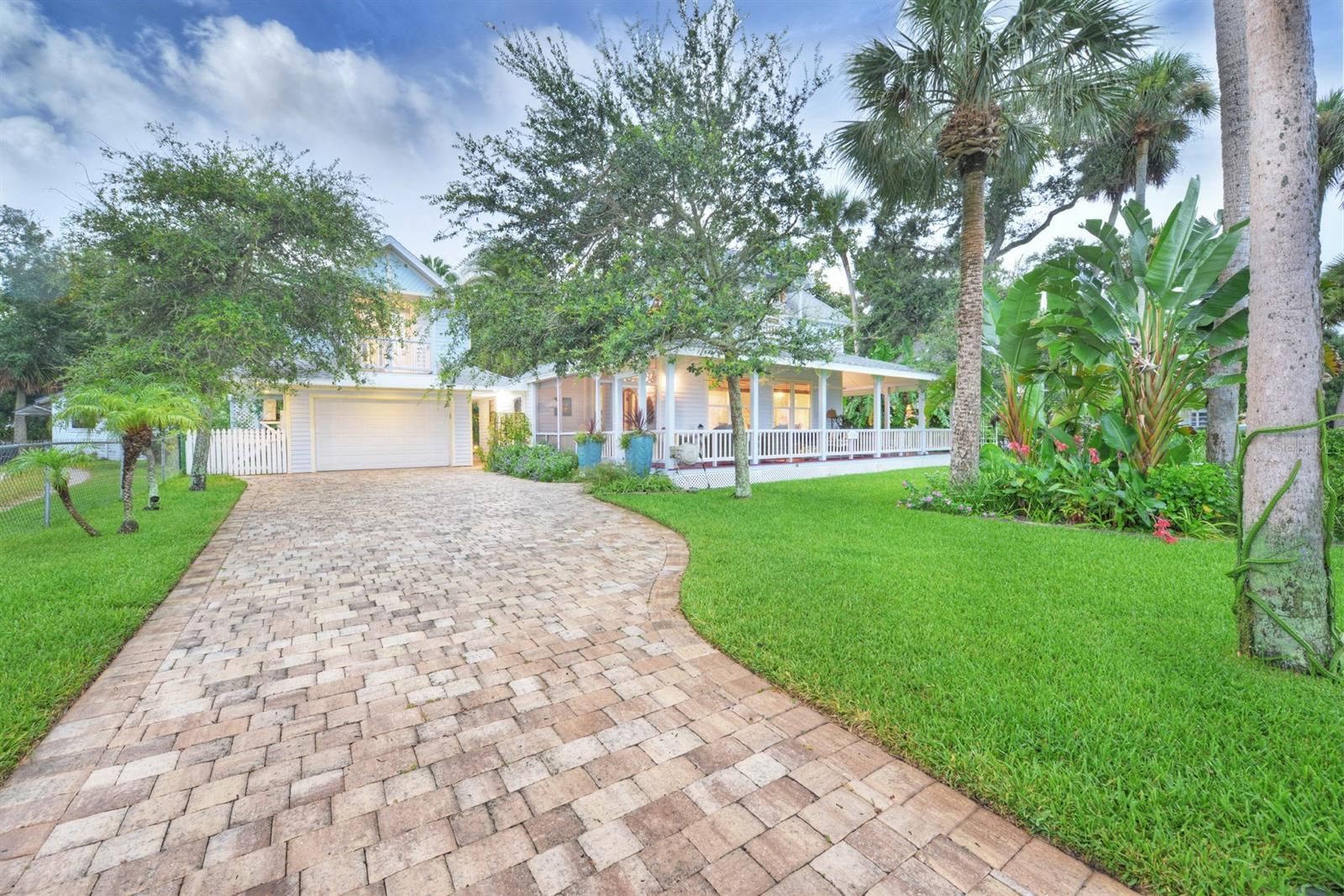 A one-of-a-kind intra-coastal historical home where Southern Charm meets Modern Luxuries. This home has a ''Key West'' feel with the wrap around porches, gorgeous water views and easy access to the boat dock and sun deck. Although it was built in 1893 it has been professionally remodeled with big walk-in closets and spacious bathrooms. It is called the Peklo House which is located on a registered historic street and district within Port Orange. You are just a 5 minute car ride to the beach or a 30 minute walk. The proposed Port Orange River Walk District is just .4 miles away. The home features a 100' dock with water/electricity, 8,000 pound boat lift and a second level sun deck. There's a 600 square foot air conditioned cottage for the in-laws with 1 bedroom, full bath, living room and kitchen. The concrete block garage was built in 2012 and has an air conditioned 20 x 14 studio apartment on the second floor with electric chair lift, full bath, small kitchen counter w/sink, refrigerator and walk-out balcony with views of the river. Vinyl gate in front yard opens up to allow room for an RV on side of home. The a/c 23 x 13 wood shop has all the electric wood tools to make their own creation. The 10 x 10 green house is perfect to grow vegetables, fruit and flowers year round. There are two separate storage areas for all your lawn tools and miscellaneous equipment. The main house has 2,859 square feet of air conditioned space offering an owner's suite downstairs and upstairs with a total of TWO bedrooms in the main home. There other two bedrooms are the cottage and the studio apartment which makes a total of four bedrooms. The front wrap-around porch with a screened area at the entrance offers spectacular views up and down the Halifax River. Plus, there's a quaint screened sleeping porch on the North side offering privacy and relaxation. ;Water: City