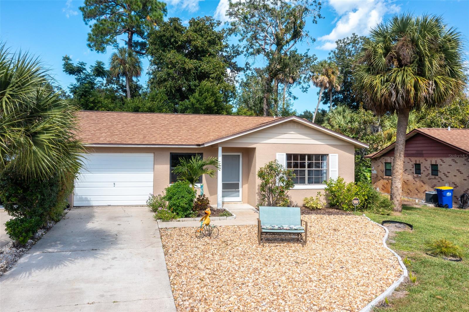 Live near and enjoy the Intracoastal Waterway in this lovely, super clean 2 bedroom/2 bathroom home!  Located in Edgewater's quiet Pelican Cove East, you'll be just a block to a private boat ramp, community dock/fishing pier, covered waterfront picnic area, and shuffleboard with membership in the voluntary HOA for just $150/year. The large primary bedroom has a private ensuite bathroom with shower and a walk-in closet. This home also features a large, private, enclosed covered patio, soft-close kitchen cabinets, attractive tile throughout, indoor laundry and a one-car garage. The friendly Pelican Cove East neighborhood is located just 7 miles from the beach and is near a variety of great restaurants, grocery stores, shopping and more. Furnishings are negotiable. This is the perfect spot for watching nature with painted buntings visiting the backyard, and dolphin and manatee in the river.  This location is also prime for watching rocket launches! Room measurements rounded to nearest foot. ;Water: City
