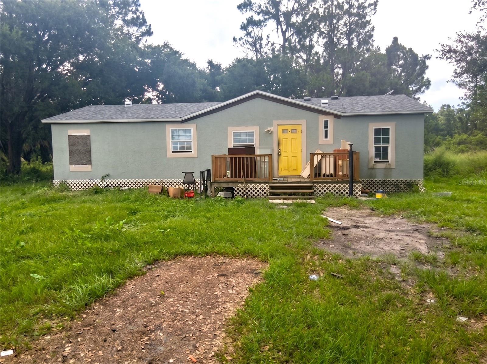 *CASH ONLY* 3296 W Lake Buffum Road is a 3-bedroom, 2-bathroom manufactured home sitting on a full, private one-acre lot in Fort Meade, Florida, being sold strictly as-is at a price that leaves plenty of room to add value. This is a fantastic opportunity for an investor, contractor, or hands-on buyer who wants a property where much of the heavy lifting is already done. With over an acre of land and no HOA, you have the kind of freedom and space that is nearly impossible to find at this price point in Polk County. Inside, the home features a spacious, open living area filled with natural light from a large picture window, along with three comfortable bedrooms and two full bathrooms, giving you a functional layout with plenty of room to live, relax, and make it your own. The best part of this home is everything that has already been taken care of. Major updates include a newer roof installed around 2024, replacement windows added around 2025, updated bathrooms with tiled showers, and updated flooring throughout. The plumbing was redone in 2020, the property is served by a newer well and a septic system that was recently pumped, and the electrical panel is in good condition. That means the big, expensive, and time-consuming items are largely behind you, allowing the next owner to focus on the finishing touches instead of the major systems. To bring this home fully back to life, it needs an air conditioning system, some minor drywall repairs, and a thorough cleanup and cosmetic refresh. For the right buyer, that short and manageable list of to-dos is exactly where the opportunity lies. Add your personal style and instantly build equity in a home that already has strong bones, recent upgrades, and a full acre of land underneath it. Speaking of the land, this is where the property truly shines. Set on a full, usable acre, it delivers authentic country living with room to spread out, park your boat, RV, work trucks, trailers, or recreational toys, plant a garden, keep animals, or add a workshop, garage, or additional structures down the road. The possibilities are wide open, and there are no HOA rules or monthly fees standing in your way. The location blends privacy with convenience. You will enjoy a peaceful, rural Polk County setting while staying within easy reach of Fort Meade, Bartow, and Lakeland for shopping, dining, schools, and daily essentials, with quick access to the highways that connect you across Central Florida. Nearby Lake Buffum adds excellent fishing, boating, and outdoor recreation just down the road. Homes on a full acre with this many completed updates and no HOA simply do not last long in today's market. Whether you are searching for your next flip, a rental to add to your portfolio, or an affordable place to call your own, 3296 W Lake Buffum Road is ready for its next chapter. Sold as-is, cash or renovation financing preferred. Schedule your private showing today, because this rare Fort Meade opportunity on a full acre will not last long.