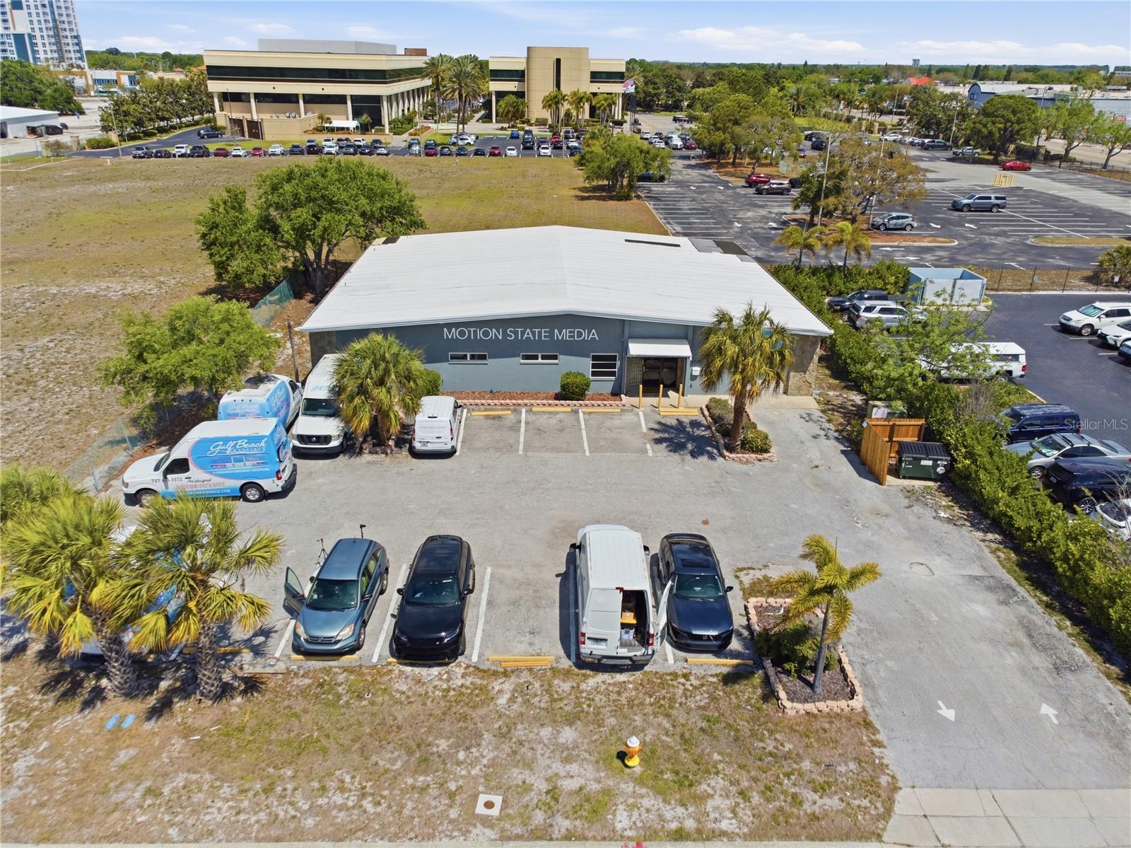 Positioned in the heart of Clearwater, within the geographic center of Pinellas County, this versatile industrial warehouse asset offers a rare opportunity to acquire a fully leased, income-producing property in one of Tampa Bay’s most supply-constrained and rapidly appreciating commercial corridors.
The property consists of two separate units, delivering flexibility for both investors and owner-users:
Unit 1 (Larger Space):
Thoughtfully laid out with three private offices, two restrooms, a reception area, and oversized storage, anchored by a massive open warehouse/studio space with approximately 30-foot ceilings—ideal for production, creative studio use, light industrial operations, or high-end showroom applications.
Unit 2:
Features a private office, kitchenette, restroom, and an open warehouse footprint—perfect for service-based businesses, distribution, or flex industrial use.
Both units are currently leased, providing immediate income. Ownership can elect to retain both tenants for stable cash flow or deliver the larger unit vacant at closing, creating a compelling opportunity for an owner-operator seeking premium industrial space in a high-demand location.
Additional highlights include:
20+ on-site parking spaces (a major advantage in land-constrained Pinellas County)
Fully air-conditioned warehouse and office areas
~30-foot clear ceiling heights offering exceptional volume and flexibility
No bay doors, making the space ideal for controlled environments such as studios, specialty operations, or showroom uses