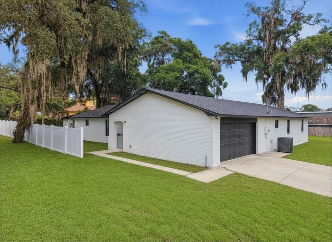 Welcome to 107 S High Street in the heart of Lake Mary! This beautifully renovated 4-bedroom, 2.5-bath home offers 2,340 square feet of thoughtfully updated living space and sits on nearly half an acre, providing plenty of room to enjoy outdoor living, entertaining, gardening, or future additions. Best of all, there is NO HOA, giving you the freedom and flexibility homeowners desire.

Nearly every aspect of the home has been upgraded, including a newer roof (2021), new windows, updated electrical, new plumbing, new HVAC system, new insulation, luxury vinyl plank flooring, fresh interior and exterior paint, and modern lighting throughout.

The stunning kitchen has been completely remodeled with new cabinetry, quartz countertops, stylish hardware, updated fixtures, and new appliances. Both full bathrooms have been fully renovated with designer tile, new vanities, modern plumbing fixtures, glass enclosures, and contemporary finishes. New trim, baseboards, and interior details add a polished touch throughout the home.

Outside, you'll find a spacious yard complete with a storage shed, offering additional space for tools, hobbies, or outdoor equipment. Energy-efficient upgrades and updated major systems provide peace of mind and help support lower utility costs for years to come.

Located in one of Lake Mary's most desirable areas, this home combines timeless charm with modern convenience. With comprehensive upgrades throughout, stylish finishes, and exceptional attention to detail, this property delivers outstanding value and long-term livability. Enjoy the benefits of a prime location, a large lot, and no HOA restrictions. Don't miss your opportunity to own this turnkey home in downtown Lake Mary!