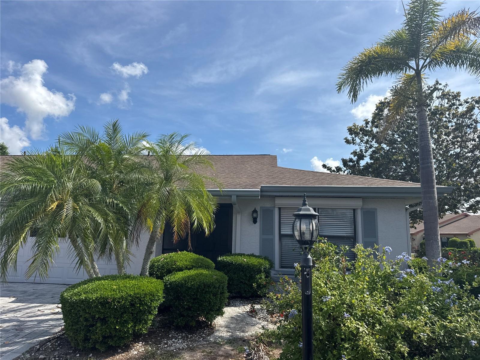 Tucked inside the gated 55+ community of Kings Point, this well-maintained 2-bedroom, 2-bath home in Lancaster III offers comfort, functionality, and an easy Florida lifestyle. Situated on a desirable corner lot in a pet-friendly section of the community, the home welcomes you with a screened front entry that’s perfect for enjoying your morning coffee or relaxing in the evenings. Inside, the open living and dining layout creates a bright and inviting space for everyday living and entertaining. Just off the kitchen, the breakfast nook offers flexibility for casual dining, a reading area, or even a small home office setup. The split-bedroom floor plan provides privacy for both owners and guests, with the spacious primary suite tucked toward the rear of the home featuring generous closet space, abundant natural light, dual vanities, and a walk-in shower. The secondary bedroom and adjacent full bath are positioned on the opposite side of the home for added convenience and guest comfort. A large Florida room lined with windows adds even more usable living space and can easily serve as a hobby room, TV lounge, or flex space. Additional highlights include a newer water heater installed in 2023 and a garage screen enclosure that allows you to enjoy fresh air and added privacy. Kings Point residents enjoy access to an impressive array of amenities including indoor and outdoor pools, fitness centers, pickleball, golf cart accessibility, social clubs, activities, and more. Monthly fees include cable, internet, water, sewer, trash, exterior maintenance, grounds maintenance, security, and private roads. Conveniently located near shopping, dining, beaches, Tampa International Airport, and Sarasota attractions, this home offers the perfect blend of relaxation and accessibility.