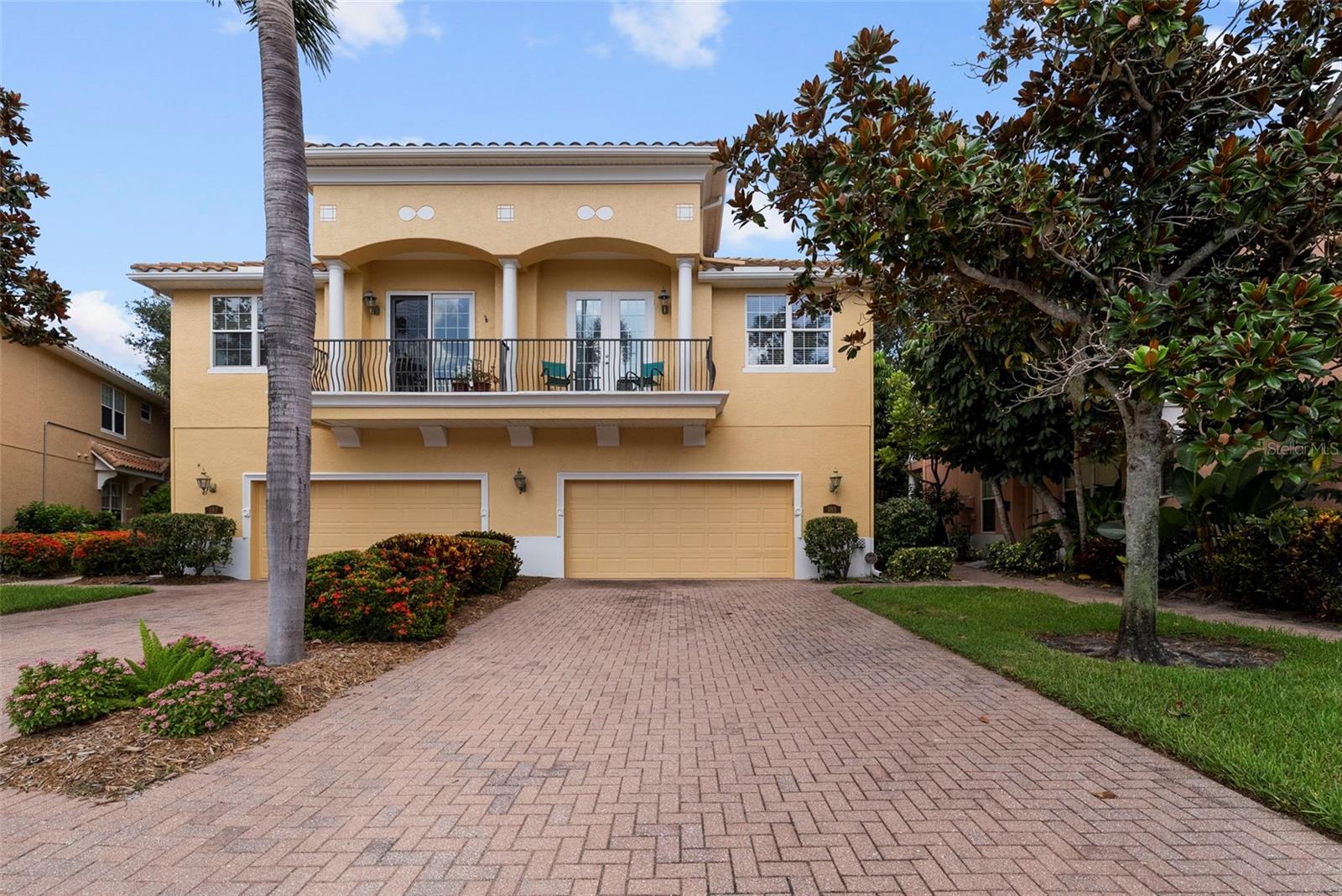 Welcome to Banyan Bay a Gated 'WORRY-FREE LIVING' waterfront townhome community nestled just south of vibrant downtown St. Petersburg. Not affected by 2024 Hurricanes flooding. From the moment you enter through the elegant wrought-iron gates, you're greeted by beautifully manicured grounds and mature landscaping that exude tranquility and pride of ownership. AMAZING HOA that provides peace-of-mind and a townhome that “LIVES LIKE A SINGLE FAMILY HOME”! Banyan Bay residents enjoy access to a heated community pool, and a private dock with 12 deeded boat slips (opportunities to rent from individual owners or purchase), a community day slip, and kayak and paddle board storage. This thoughtfully updated 3-bedroom, 2.5-bath features Luxury finishes throughout such as Quartz countertops, Porcelain sinks in all bathrooms, Luxury vinyl plank flooring (LVT) throughout, all IMPACT-RATED windows, doors and Garage Door, for storm safety and energy efficiency. Downstairs open-concept living/dining layout offers flexible arrangement options, tall ceilings, tall windows with Hunter Douglas PLANTATION shutters, a guest 1/2 bath and indoor laundry room. The CUSTOM designed kitchen offers Café appliances, DOUBLE electric range with APP-CONTROLLED, sealed MARBLE countertops, porcelain APRON sink with OFFSET drain, ISLAND with power and storage, large PANTRY closet, above-cabinet and under-cabinet LED lighting, Hunter Douglass MOTORIZED window shade. Coat closet with ample storage under staircase could be used for holiday and seasonal decor. Hurricane impact slider, with a motorized shade, leads out to the rear SCREENED porch and open-air extended patio, with room for your own grill, and framed by a privacy hedge providing a relaxing atmosphere for entertaining. Upstairs Comfort & Style is evident in the LOFT with a custom built-in niche providing additional storage. The stunning primary suite features a high COFFERED ceiling, a custom designed California Closet system featuring wall-to-wall VALET cabinetry, integrated make-up niche with dimmable lighting, and French doors leading to a private BALCONY. Spacious guest bedrooms and vaulted ceilings extend throughout the upper level, creating a bright and open ambiance. Additional SMART-HOME FEATURES & modern utilities include APP-CONTROLLED LG washer & dryer, NEST smoke detectors, GE whole-home water FILTRATION system with remote shutoff, APP-CONTROLLED RHEEM water heater (2020), HVAC system (2019) with UV antimicrobial light, OVERSIZED 2-Car Garage with MyQ SMART GARAGE opener on HURRICANE-RATED door, EPOXY floor, overhead storage and EV CHARGER-READY hookup (240v / 60-amp breaker). The comprehensive HOA includes ALL Exterior PAINT of the home and community (Community painted 2Q 2024), ROOF repairs & maintenance, INSURANCE flood and structures (owner only needs “walls in” coverage), WATER, 500 gig INTERNET, Spectrum CABLE, Common area LANDSCAPING, Irrigation, maintenance of the DOCK, POOL, Pool AMENITIES, GATE and the Private ROAD maintenance. LARGE DOG Friendly! Banyan Bay offers a rare blend of privacy, smart-living, and waterfront amenities—this Townhome is NOT in a flood zone and unaffected by recent storms. Within minutes from the Gulf beaches, and everything St. Petersburg has to offer. This is not just a home—it’s a lifestyle. Come see it for yourself.