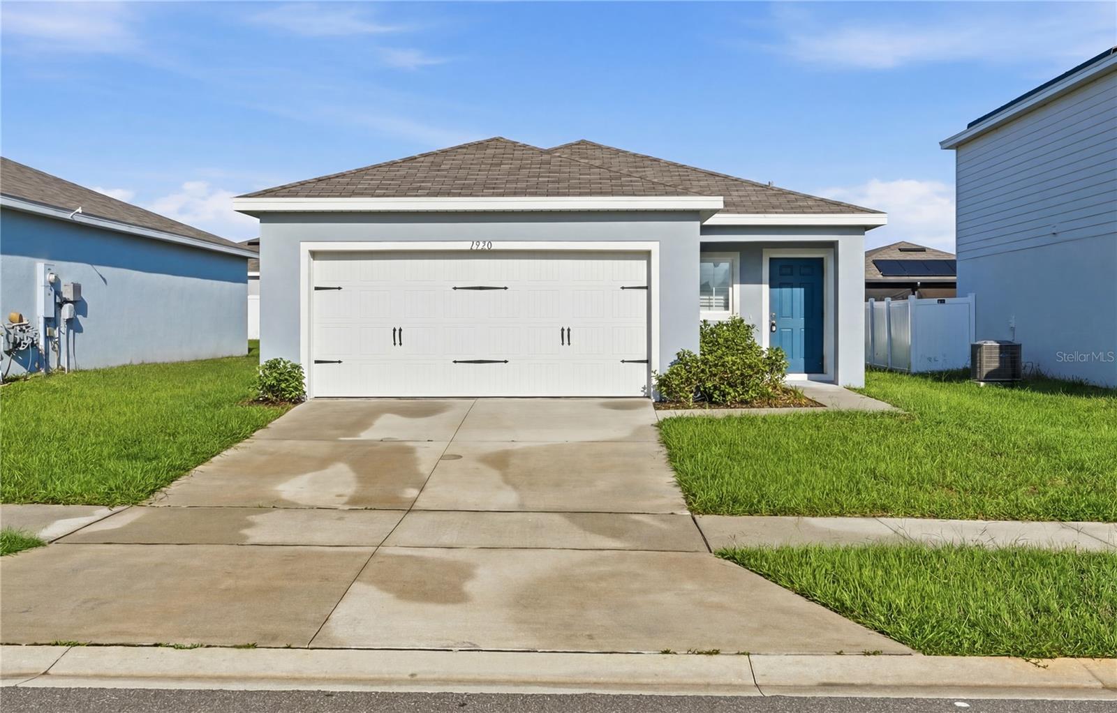 Move-in ready, Gracelyn Grove, a Ryan Homes community, offers the best of both worlds: peaceful suburban living with easy access to big-city excitement. Located in beautiful, historic Haines City, Florida, off US-27 with quick access to I-4. Living here not only puts you close to some of Central Florida's top attractions: Legoland and Bok Towers, to name a few, but also to everyday shopping. A Publix is just an 8-minute drive away, and a wide variety of dining options at Posner Park are only 20 minutes away. Looking for a stylish movie night? The Cinepolis Luxury Cinema is a 20-minute drive up the road. The kitchen features an island with a sink and breakfast bar. From the dining area, you have entry to two bedrooms and a bathroom. At the back of the house, you'll find the Great Room and the Owner's Suite, which includes a walk-in closet, dual sinks, and a shower. This home is perfectly laid out to give you the space you need at an affordable luxury price. Includes a Wi-Fi-enabled garage door opener and an Ecobee thermostat.
