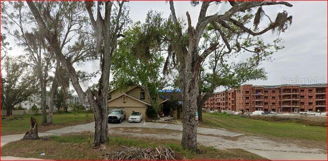 Terrific location. Across from St. Joseph's Hospital. Apartments abut this property.  Value is in the Land. Call Hillsborough County for information regarding zoning variance and development possibilities. Land is just under 1 acre. Mixed use varriance has been recently obtained by neighboring lots. Please do not disturb the tenants. Possible owner financing.