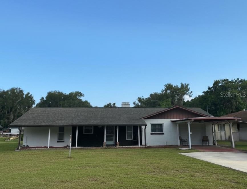 Discover the charm of true Florida living in this Fisherman's retreat! Inviting 3 bedroom, 2 bath home perfectly positioned on a spring-fed canal with direct access to beautiful Lake Panasoffkee. Split bedroom plan and open living areas offer a comfortable layout and plenty of space, ready for your personal touch. The bedrooms are roomy with large closets. The garage plus carport allows parking for the whole family.
Step outside onto one of your porches and enjoy a property designed for both relaxation and functionality. You’ll find a covered picnic table, outside bar, workshop with storage, covered storage, an elevated dock ideal for parking your boat, fishing or simply unwinding while taking in the peaceful waterfront views. The property also features a dockside outdoor cook shed and a dedicated entertainment room, making it easy to host gatherings or enjoy quiet evenings outdoors.
Only a few miles to I-75 gives you easy access to everything you need. Located in a great community on a quiet cul-de-sac, this home is full of potential and ready to be transformed into your perfect waterfront escape.